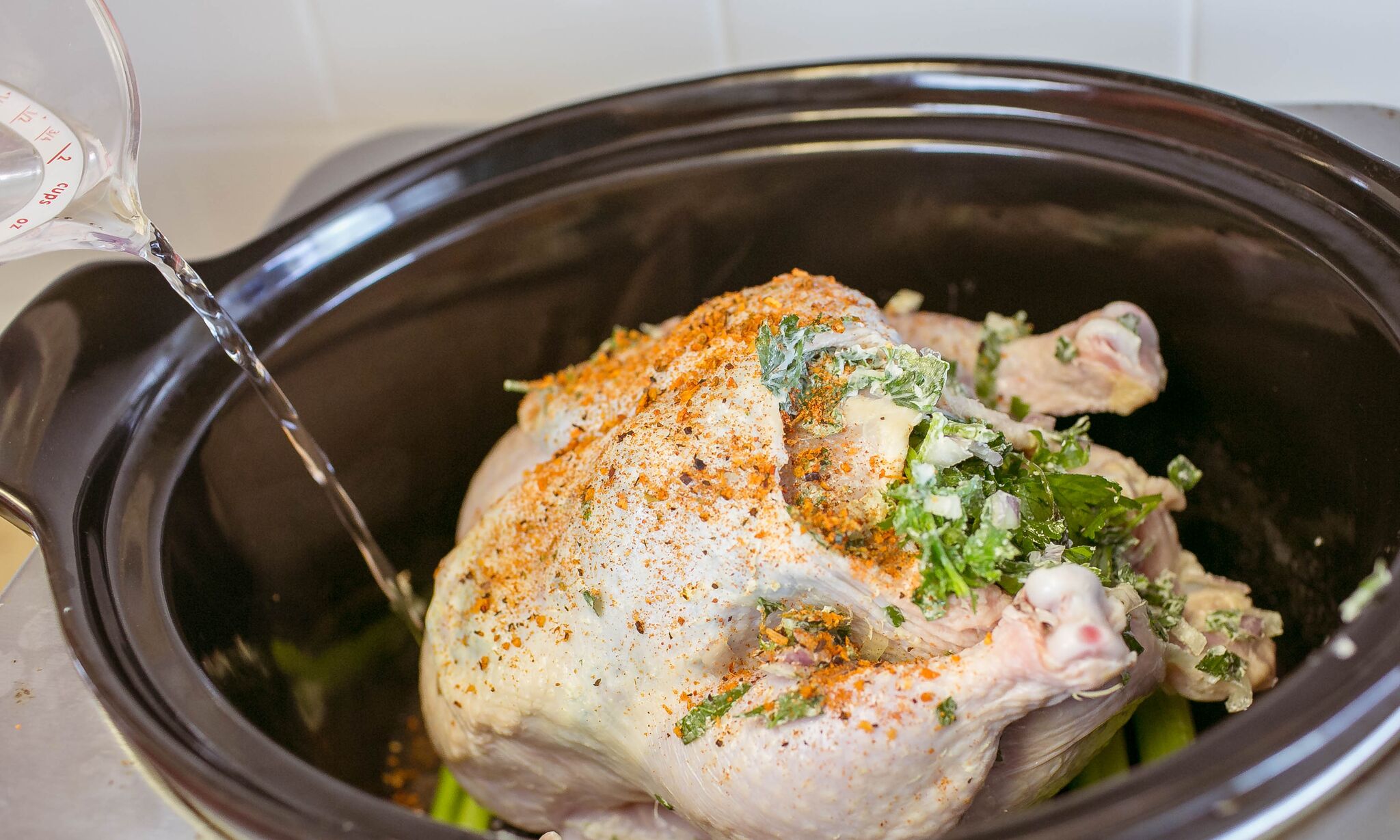 Add water to the slow cooker. 