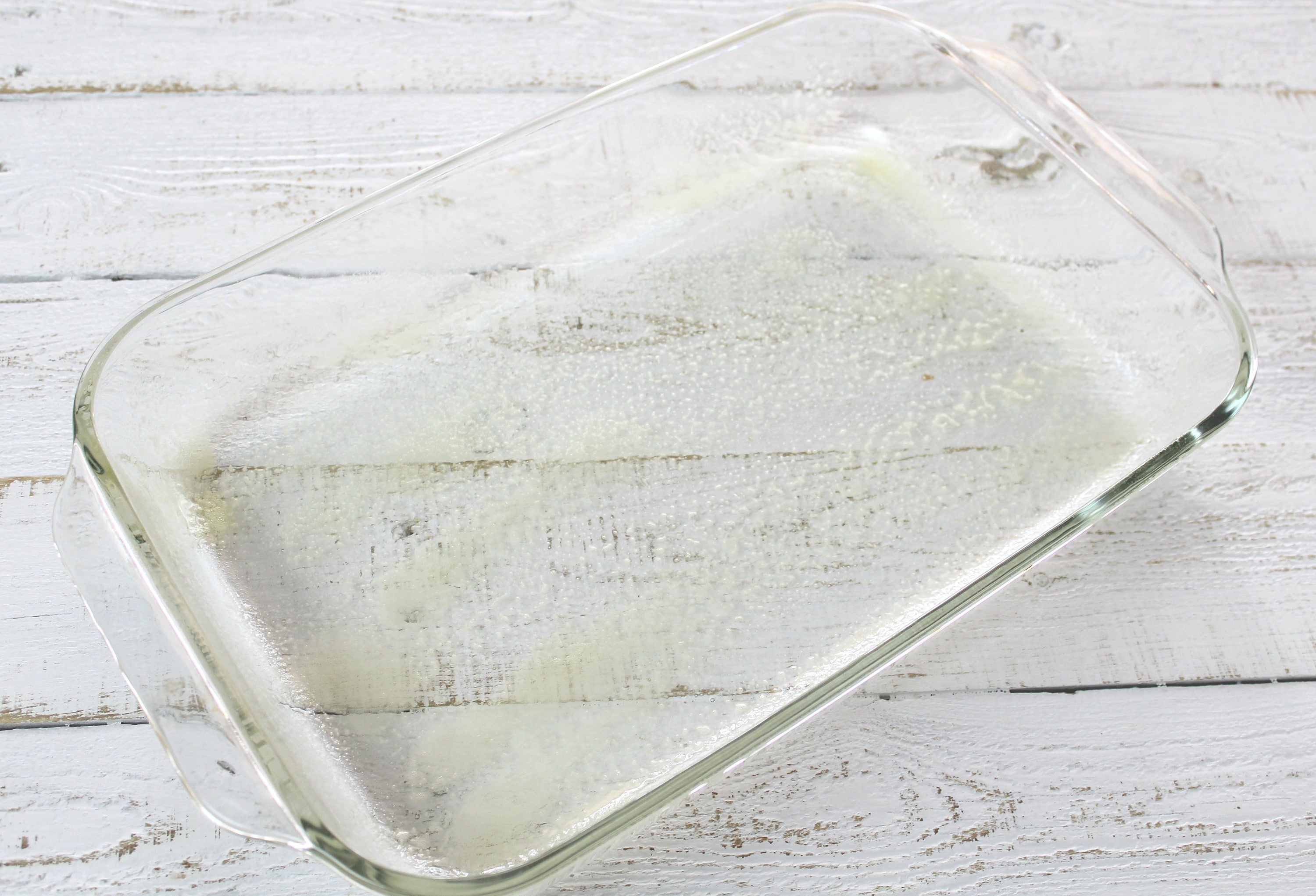 Grease the bottom and sides of a casserole dish to prevent sticking. 