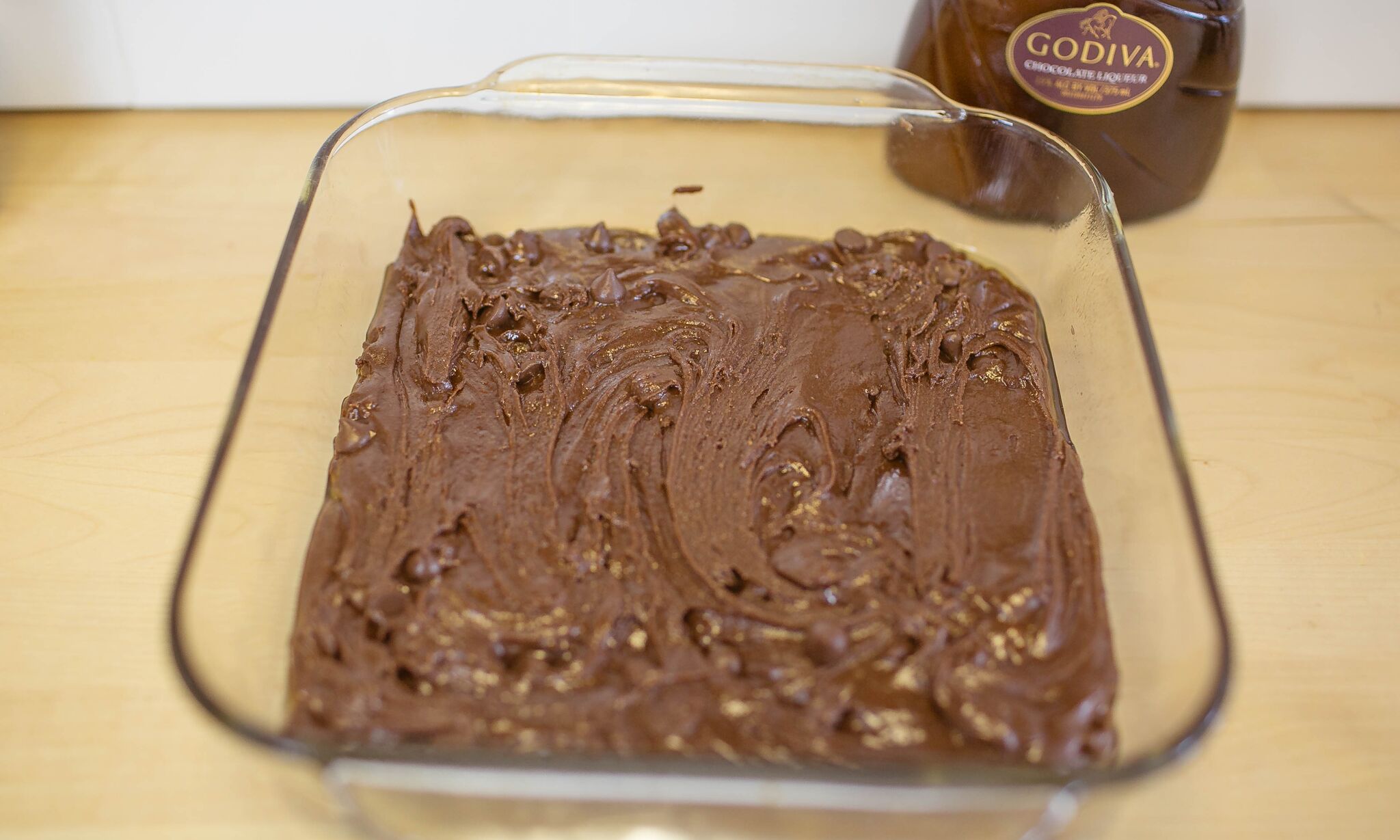 Pour brownie mix into a prepared pan.