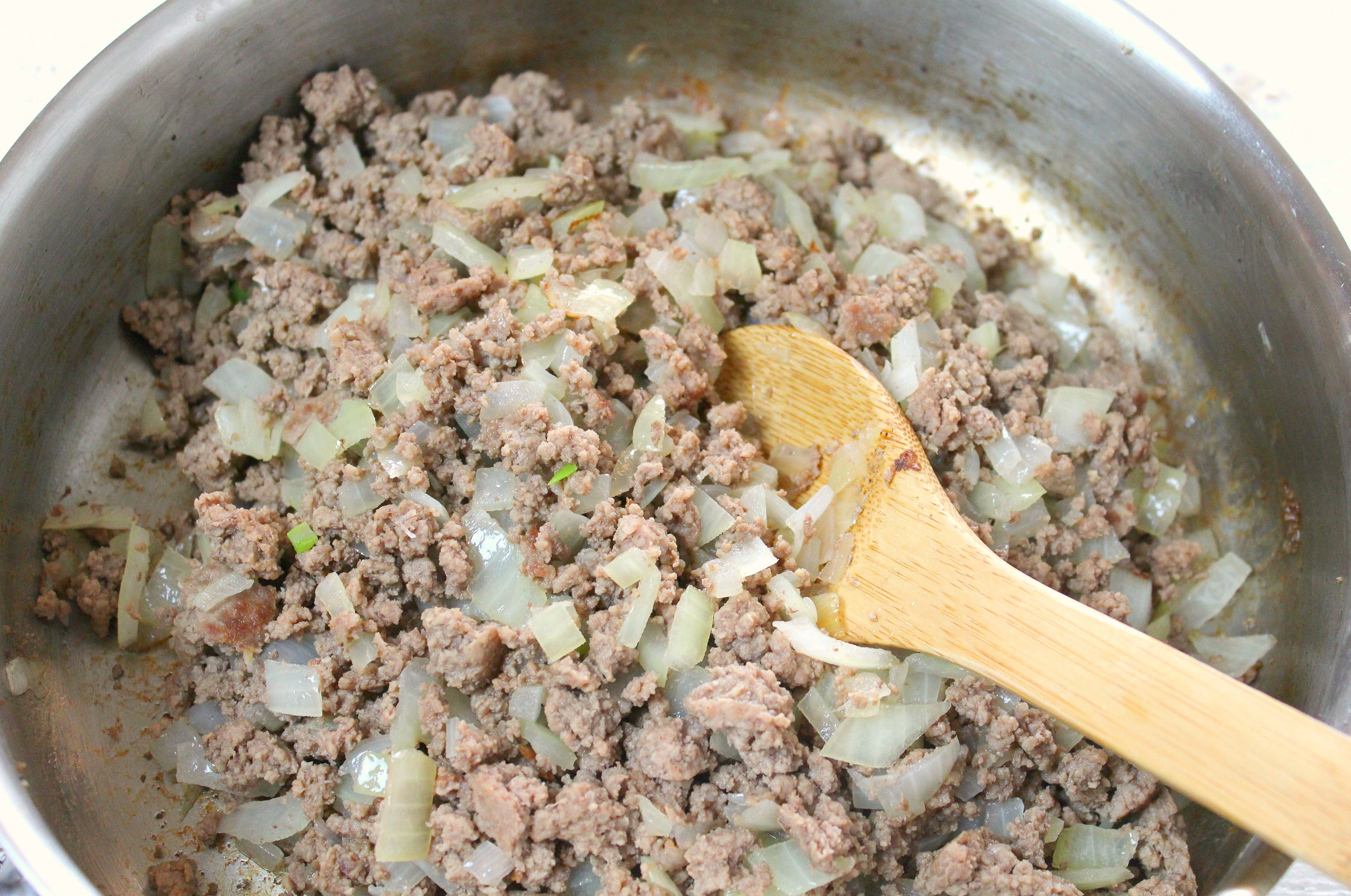 Tater Tot Casserole | Brown the ground beef in a pan and add in your diced onions. 