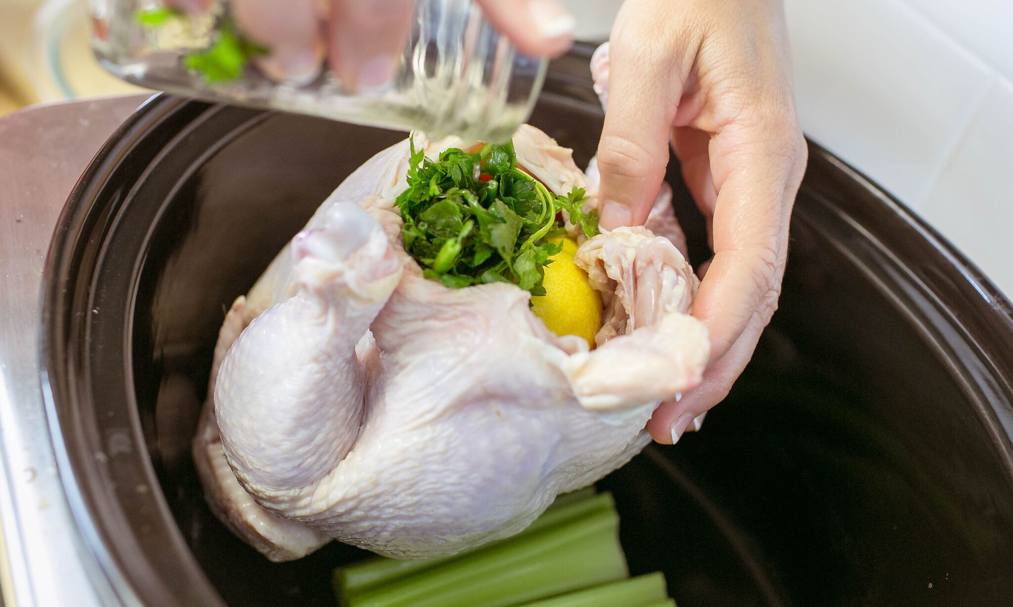 Add lemon juice and parsley to cavity of chicken. 