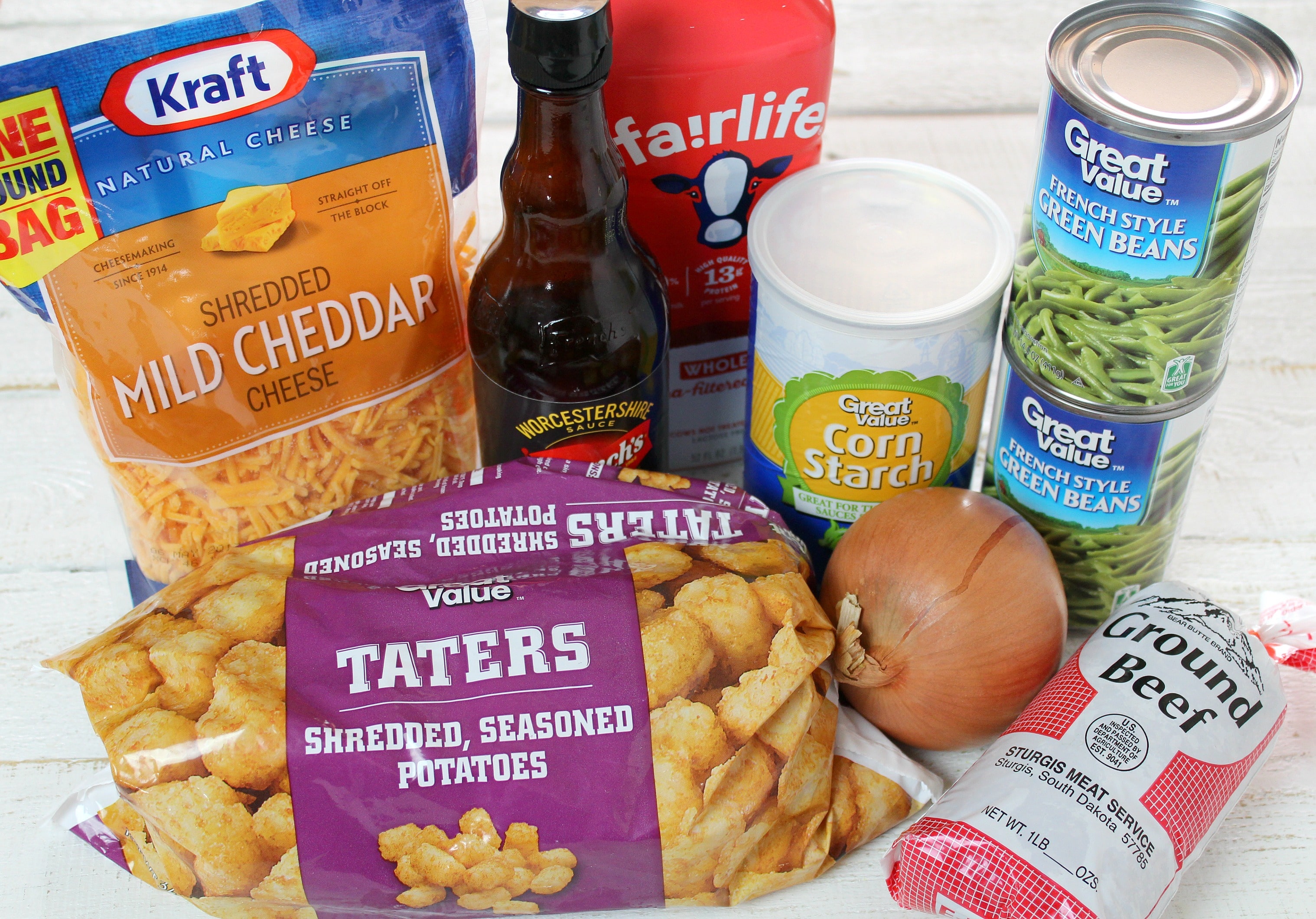 Tater Tot Casserole ingredients - you need shredded mild cheddar cheese, worcester sauce, milk, corn starch, green beans, ground beef and tater tots.