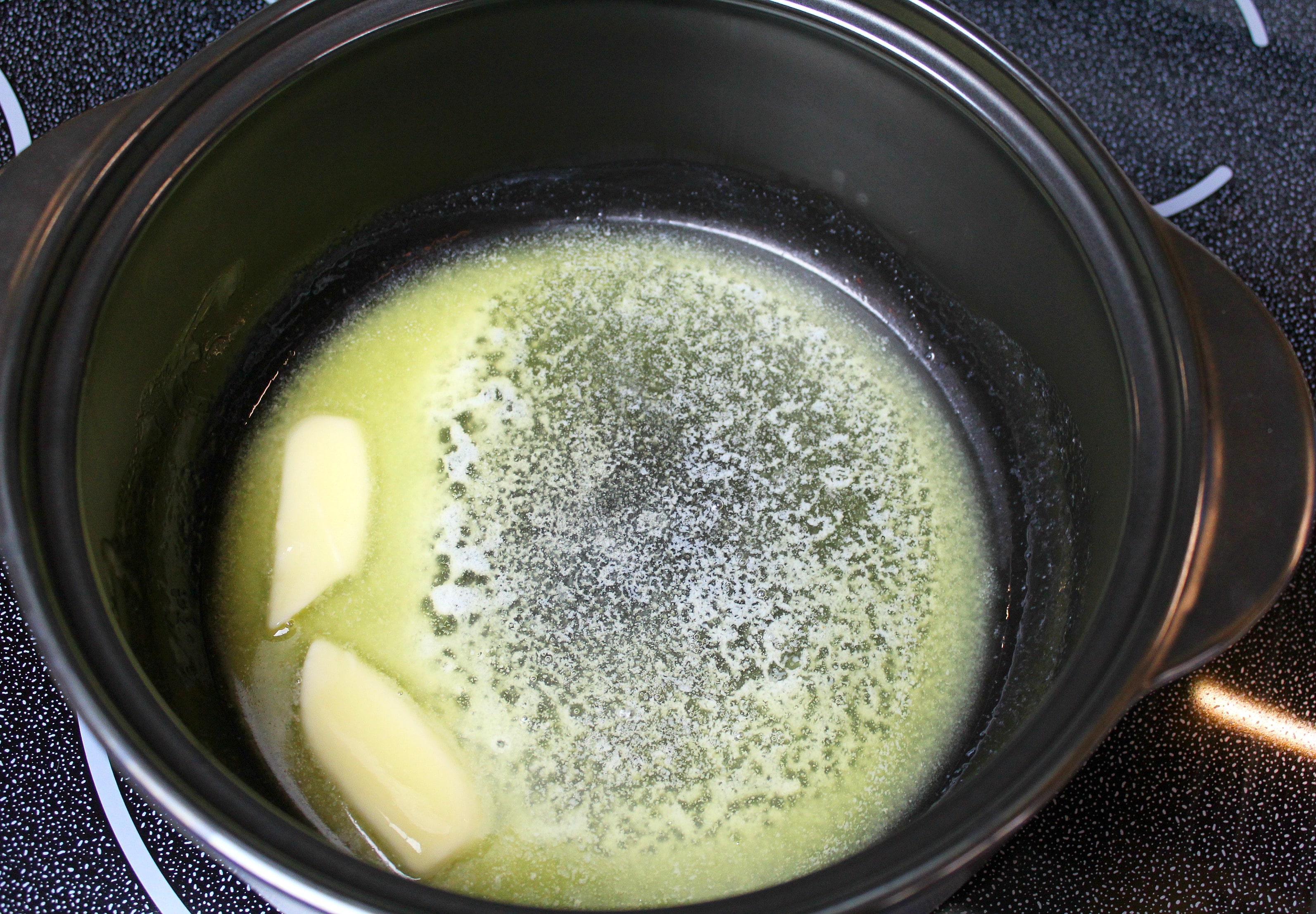 Melt your stick of butter in a pan over low heat. 