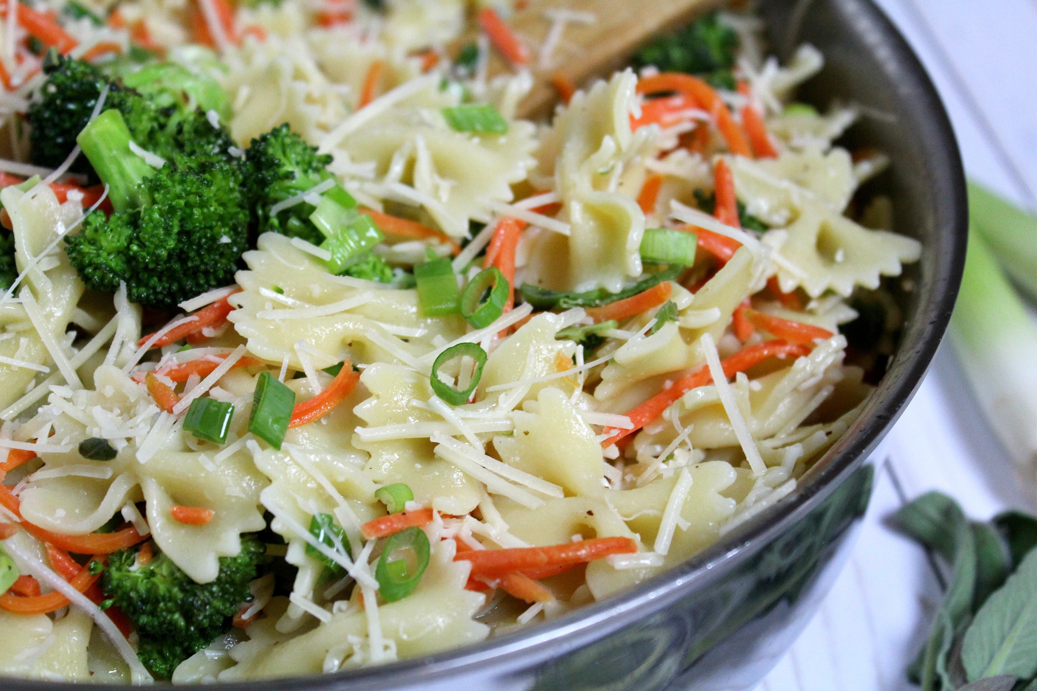 Combine veggies with pasta. Dress with shredded parmesan cheese and lemon dressing. 