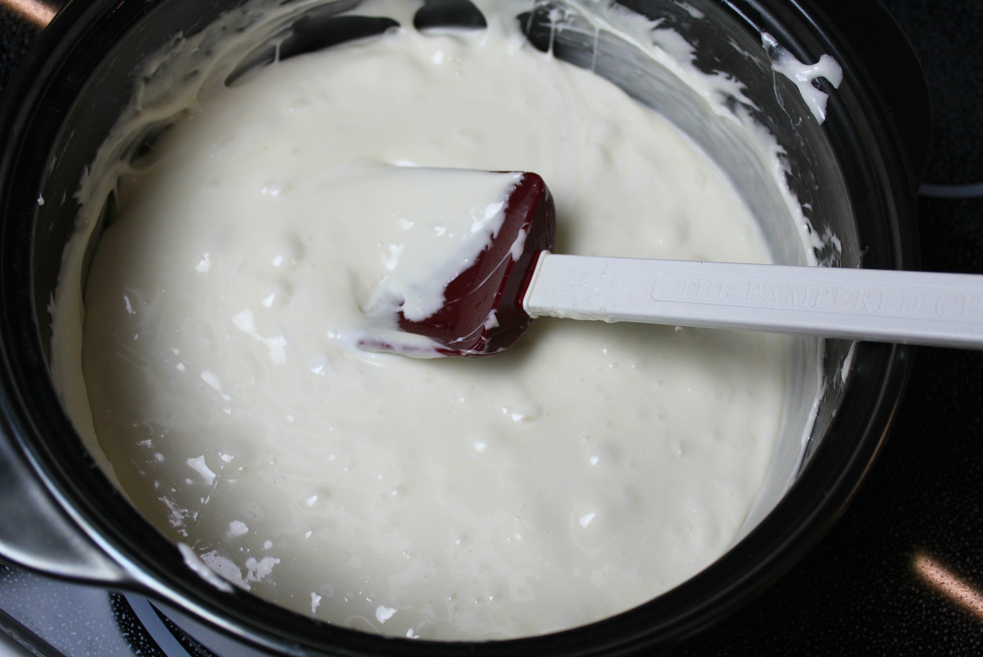 Stir the marshmallows and white chocolate until the mixture is smooth and glossy. 