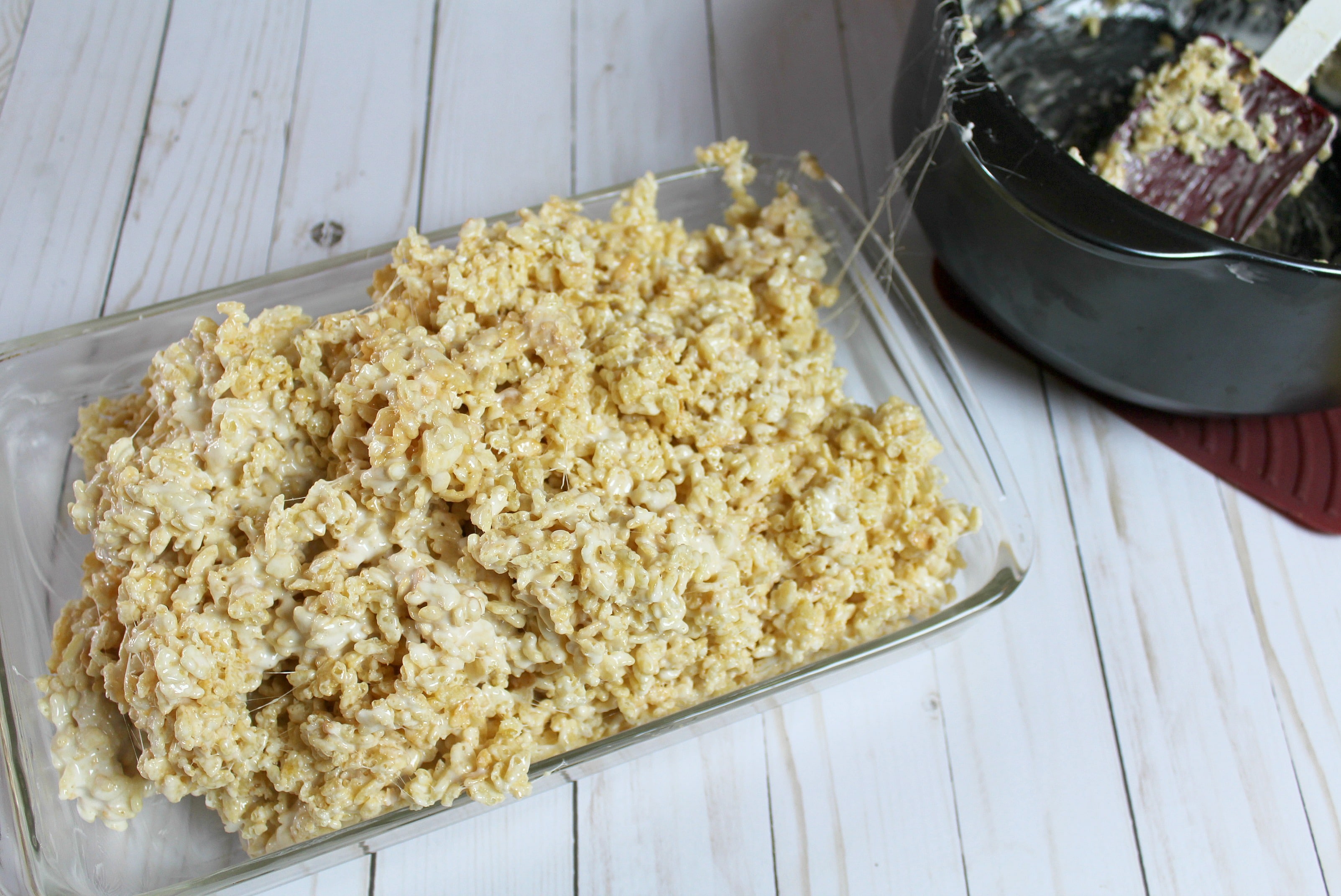 Pour the sticky rice crispy mixture from the bowl into the pan. 