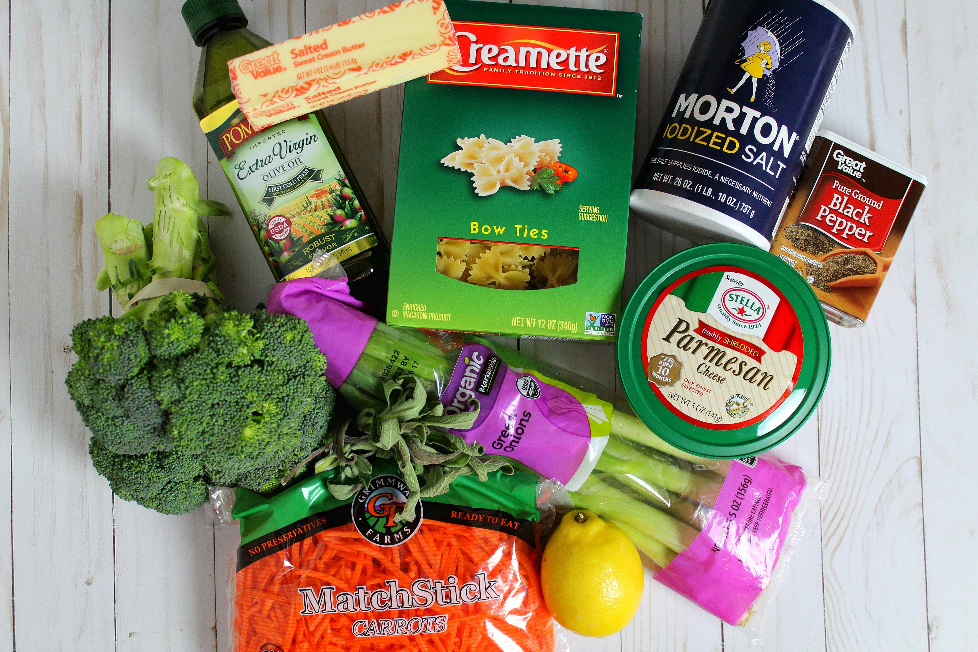 Assemble your ingredients: olive oil, butter, carrots, green onions, broccoli, fresh sage, bow tie pasta, lemon, salt, pepper, Parmesan cheese. 