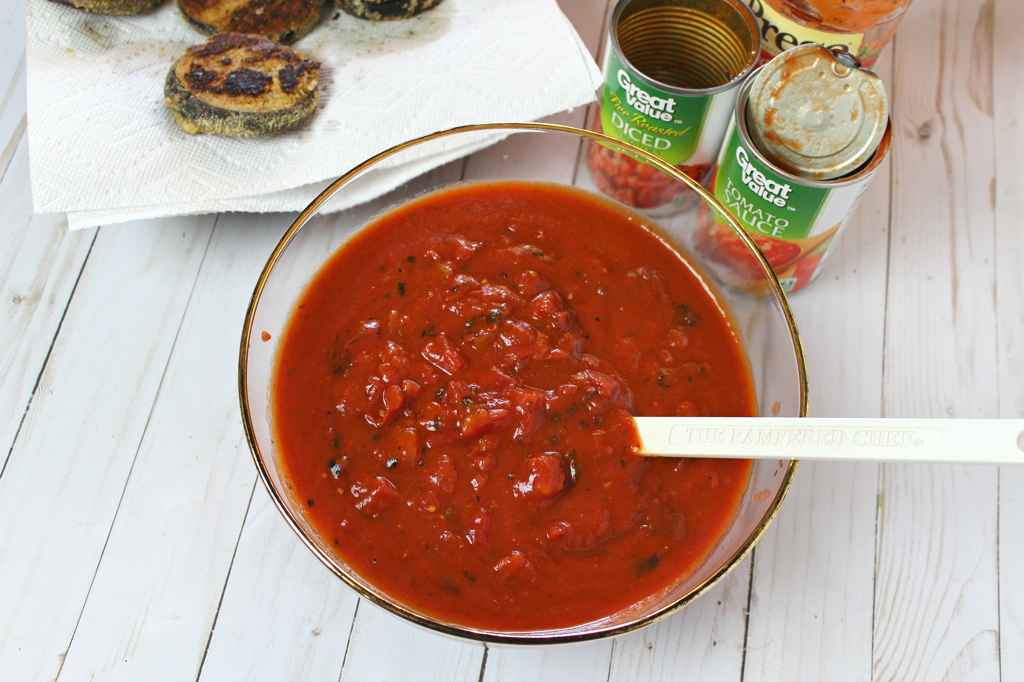 Mix spaghetti sauce, tomato sauce & diced tomatoes in bowl.