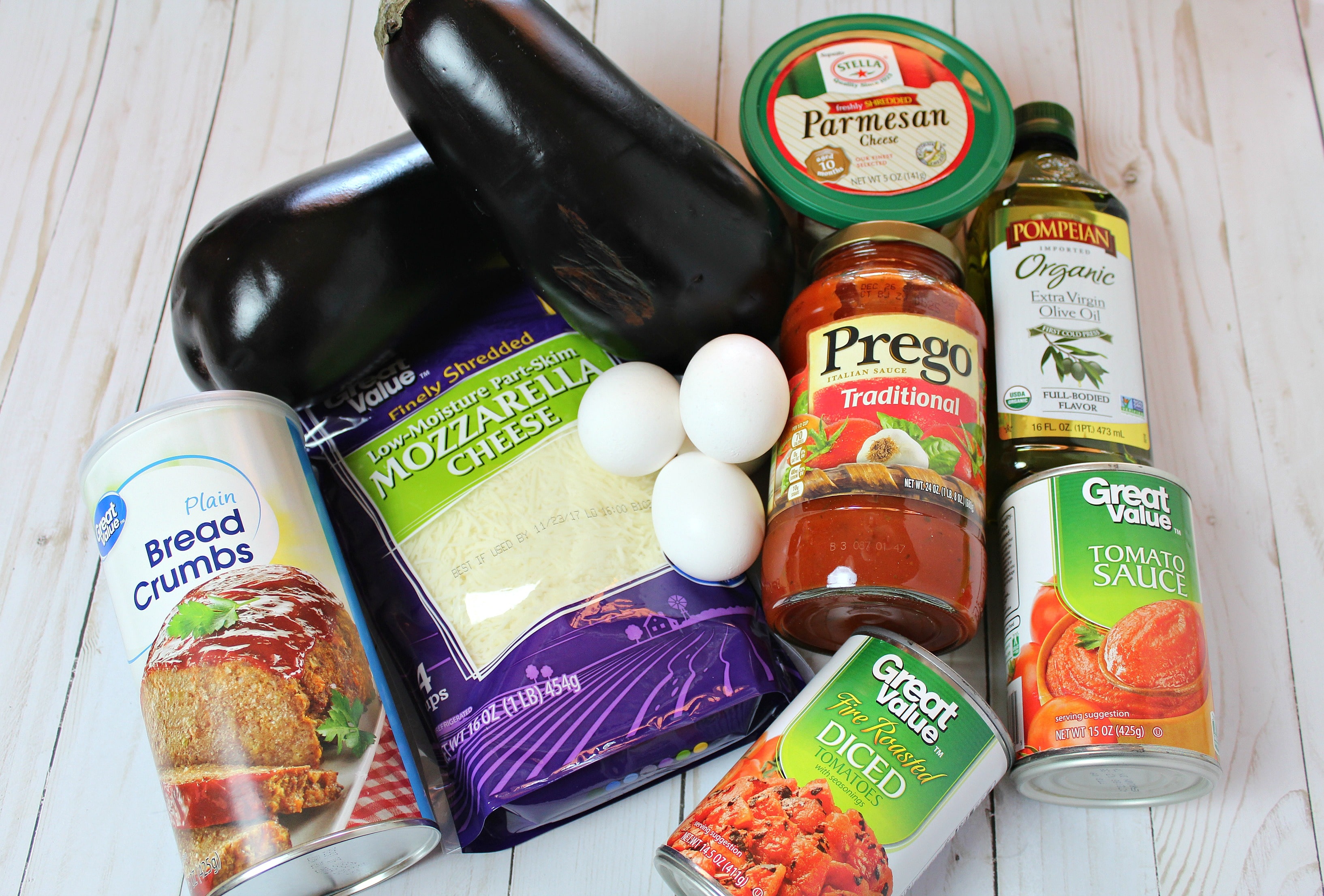 Assemble your ingredients: eggplants, eggs, seasoned dry bread crumbs, olive oil, cooking spray, spaghetti sauce, tomato sauce, fire roasted diced tomatoes, shredded mozzarella cheese, Parmesan cheese and salt.