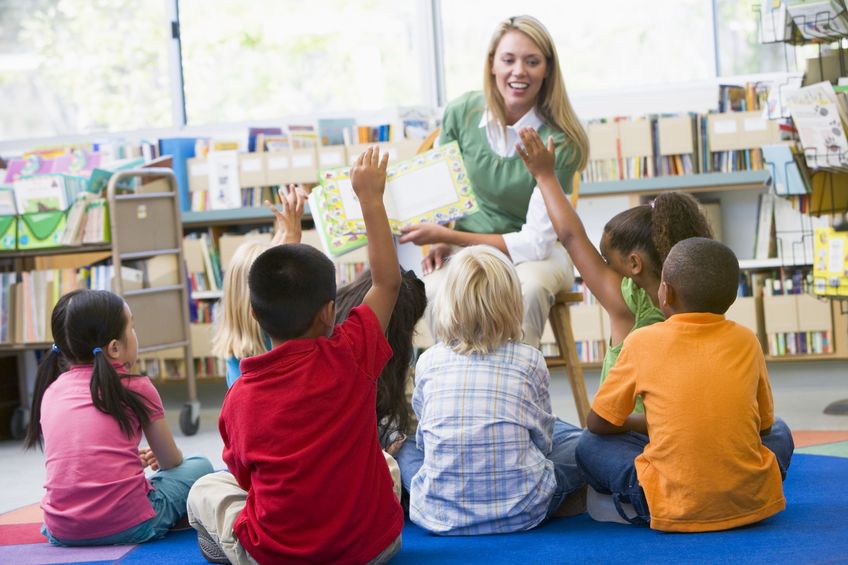 Volunteering your time to read books to your child's class is a helpful way to show support for teachers. 