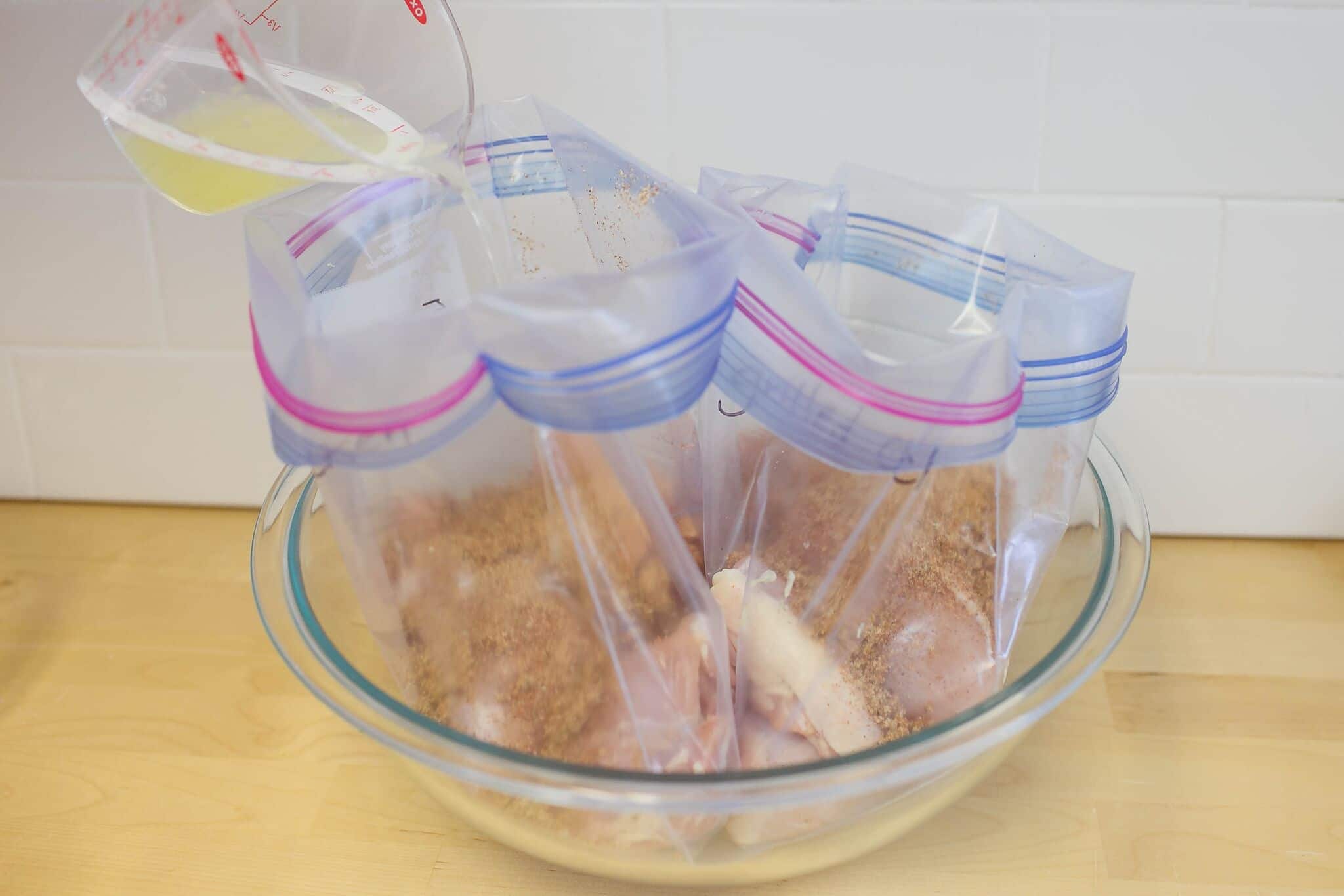 Divide chicken into freezer bags with spices and lime juice. 