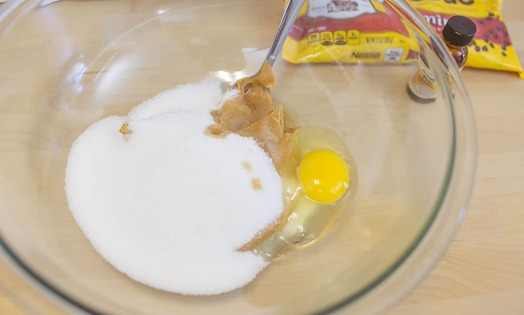 Beat together sugar, peanut butter, vanilla and egg in mixing bowl.