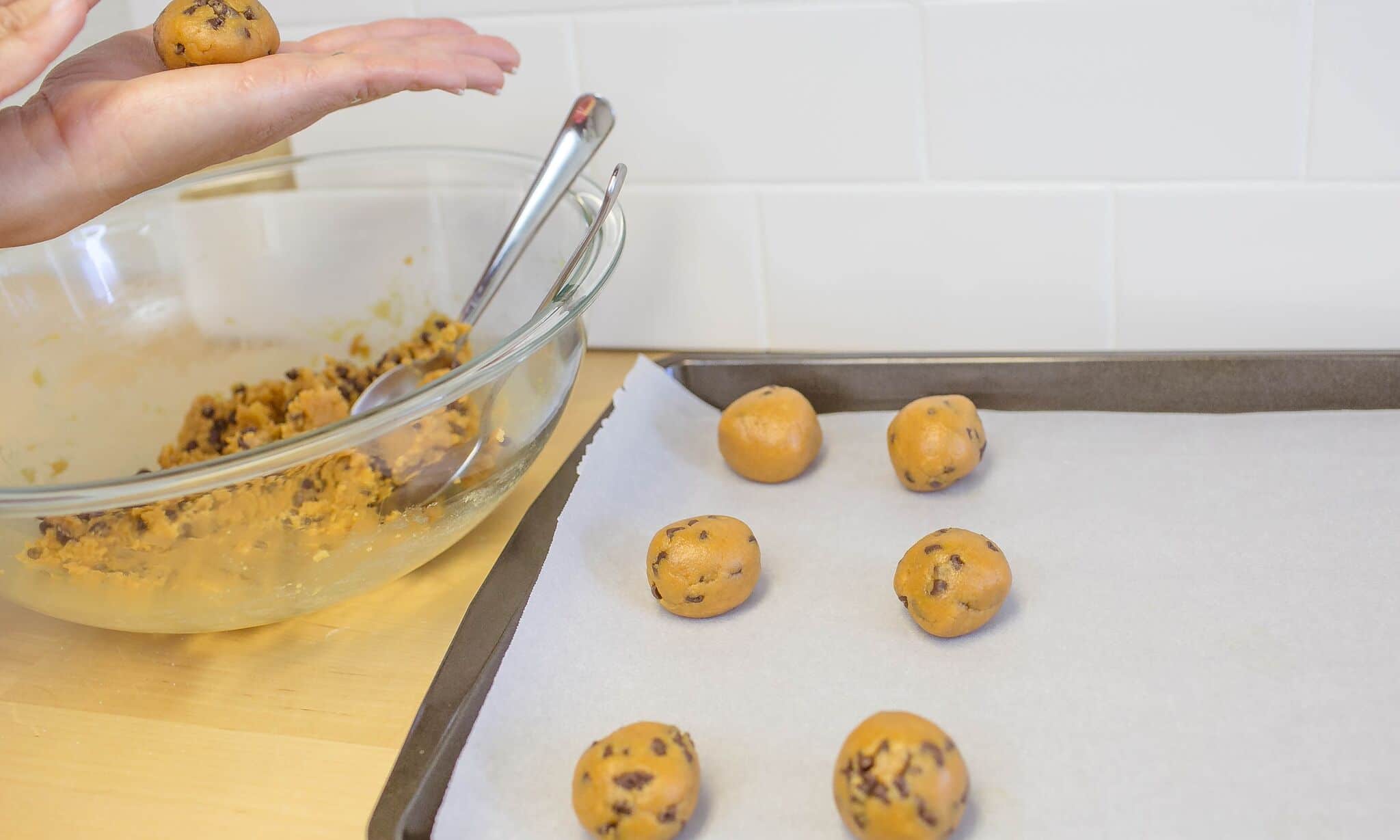 Use a teaspoon to scoop mixture and roll into balls on cookie sheet lined with parchment paper. 