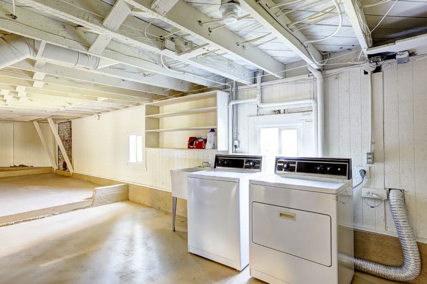 A clean laundry room with a washer and dryer. 