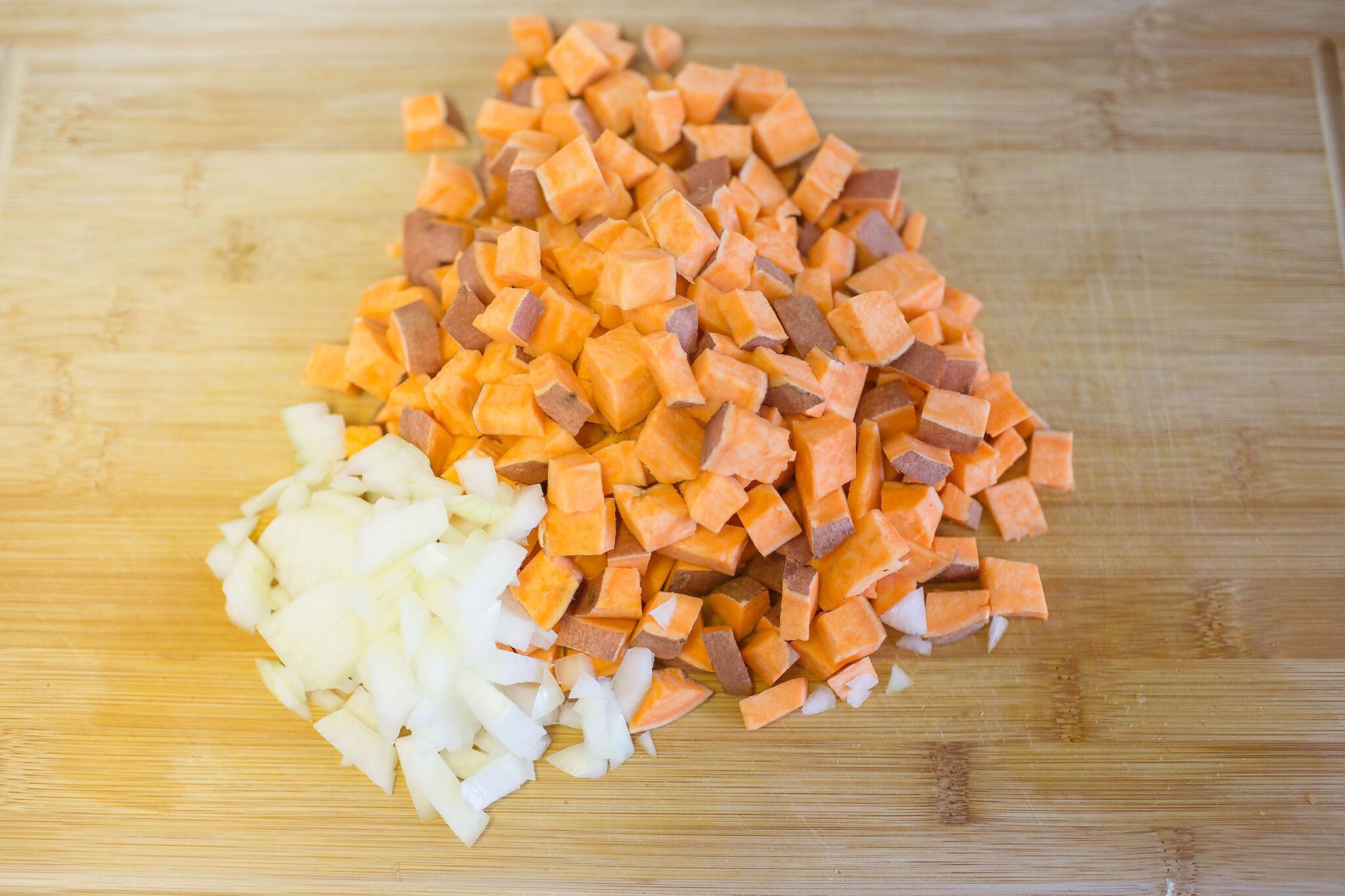 Clean and dice sweet potato, then dice onion and set aside.