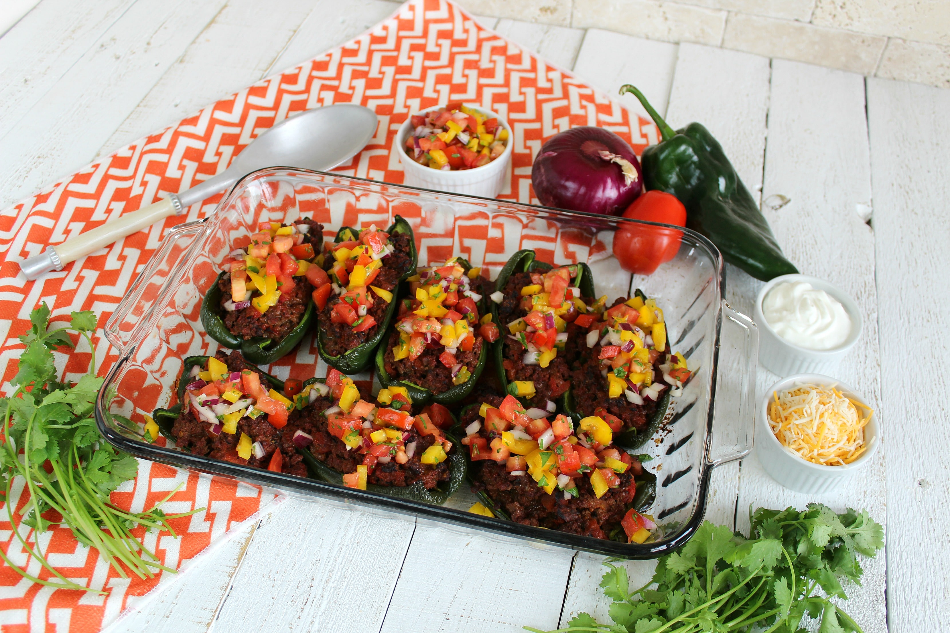 Top stuffed poblano peppers with tomato mixture. 