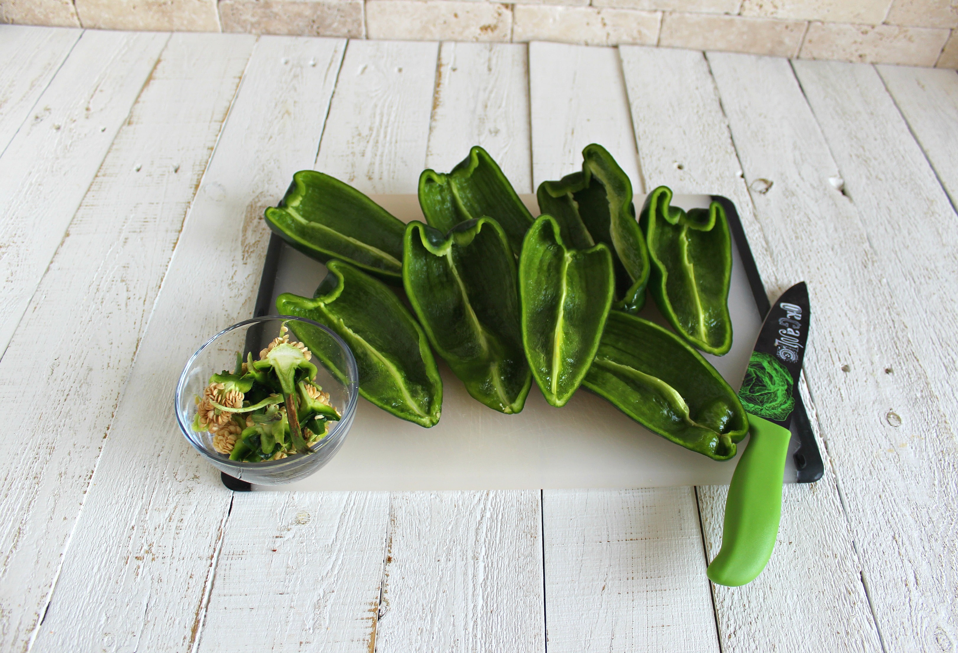 Cut Poblano peppers in half. 