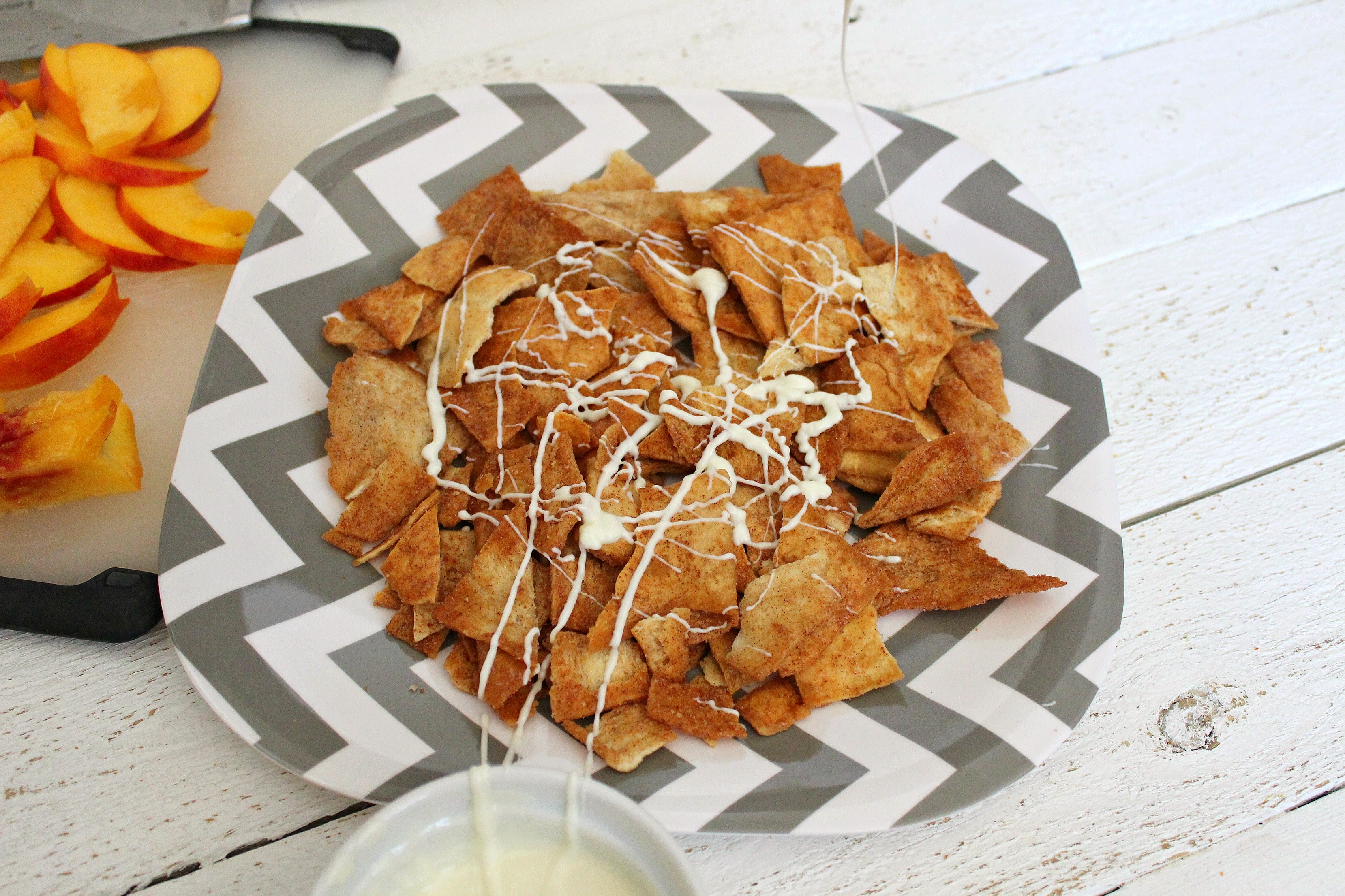 Drizzle melted white chocolate over cinnamon pita chips. 