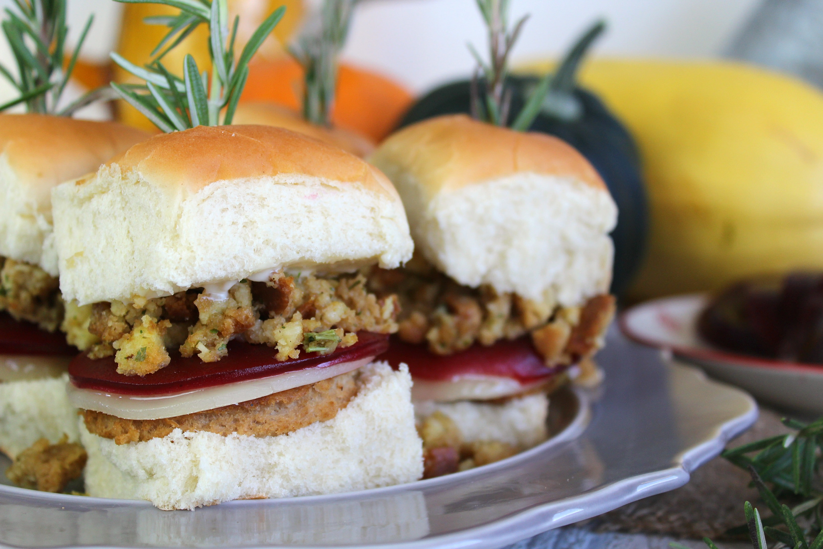 Serve the finished Thanksgiving sliders with fresh rosemary. 