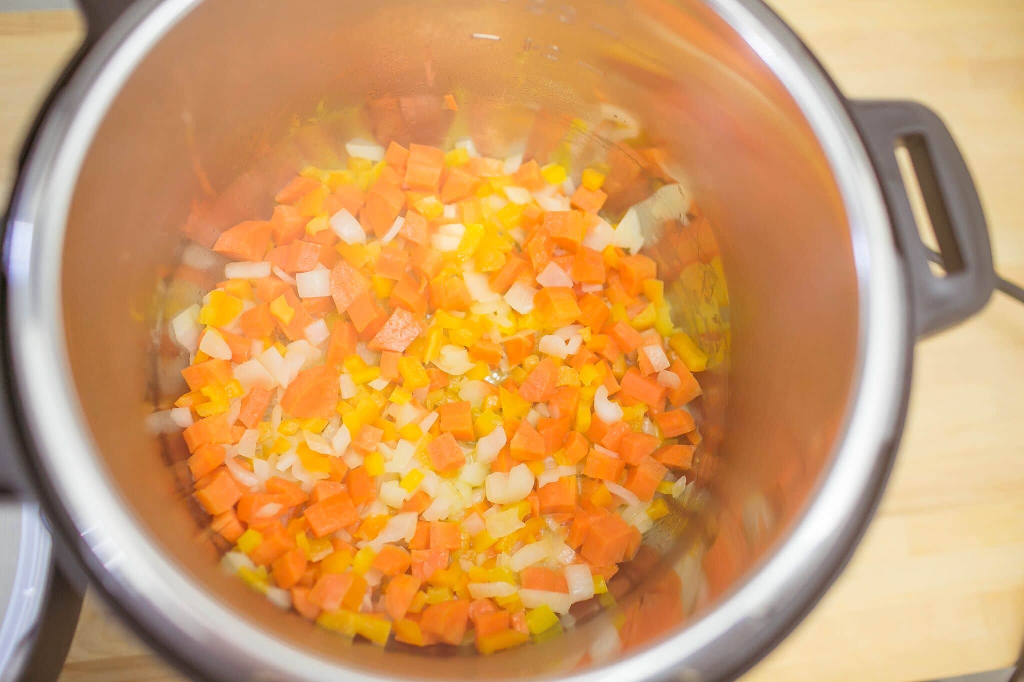 Saute carrots, onions, and peppers for 5 minutes