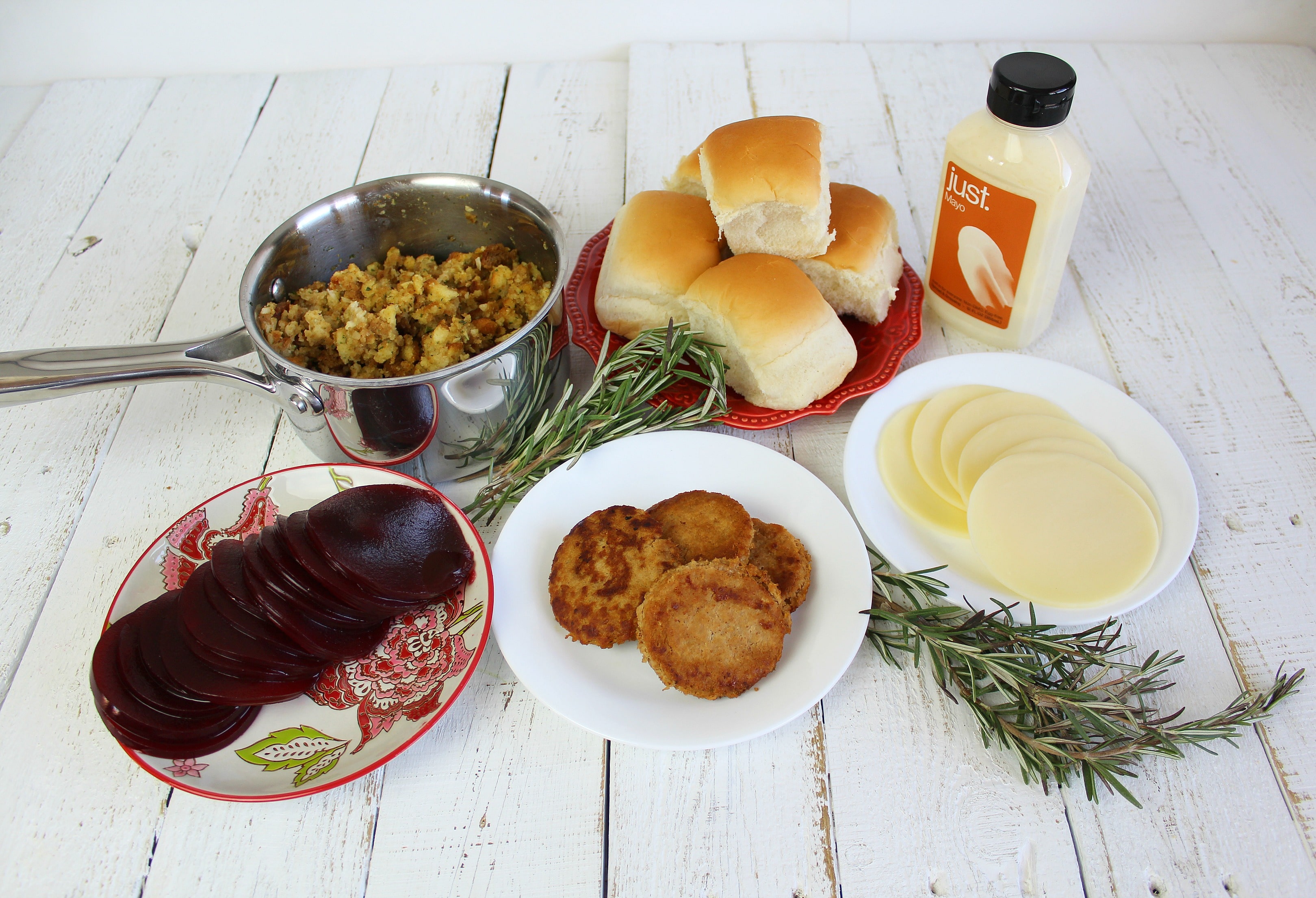 Lay out all your ingredients before cooking: turkey burgers and stuffing warmed, cheese and cranberry sauce sliced.