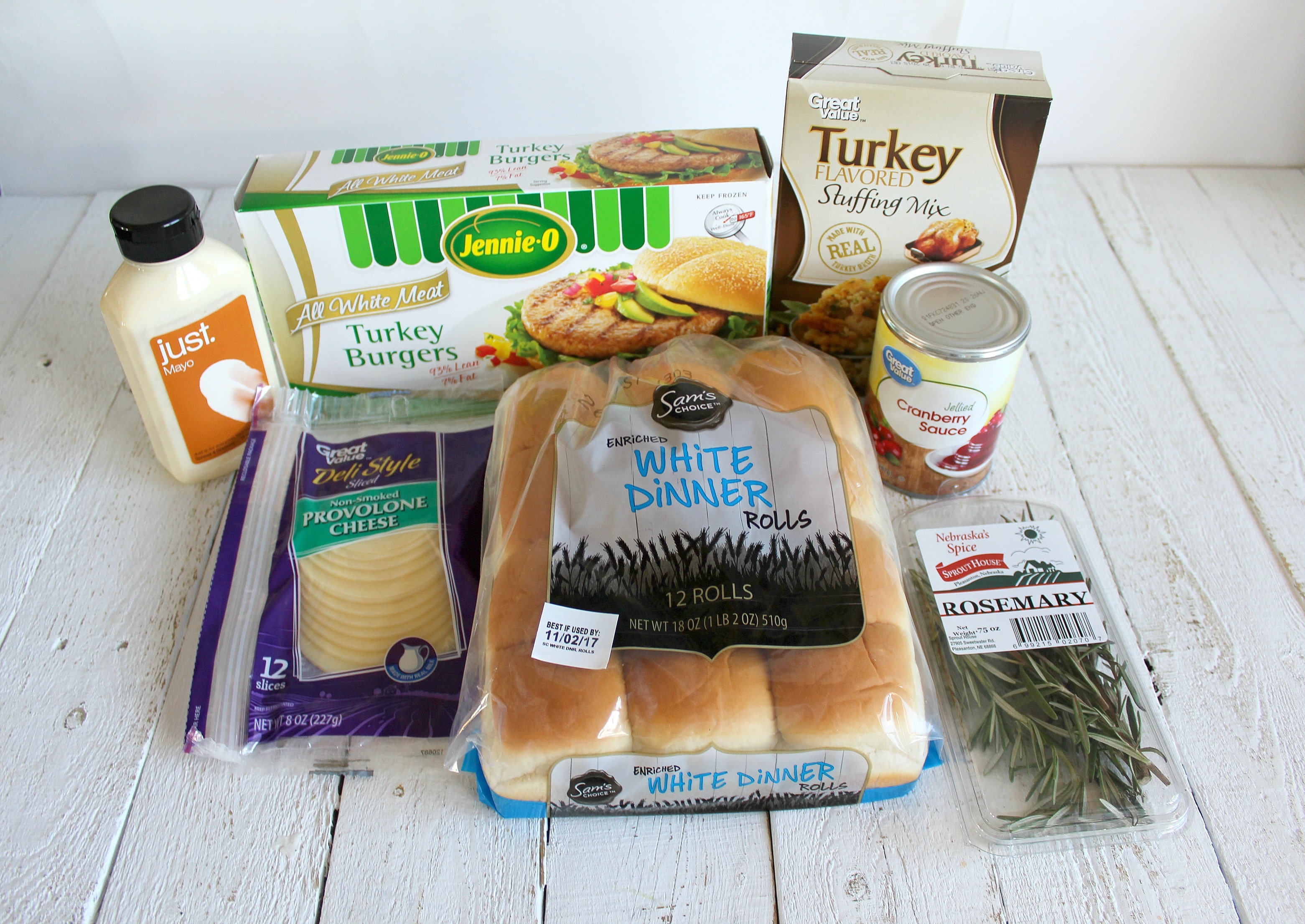 Assemble your Thanksgiving slider ingredients: frozen turkey burgers, stuffing mix, cranberry sauce, dinner rolls, provolone cheese slices, mayo and rosemary. 