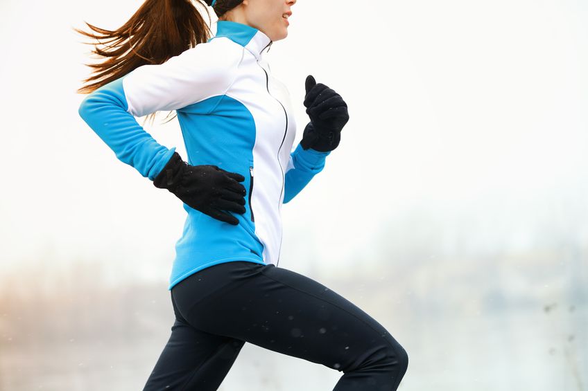 A woman going for a run in the winter. 