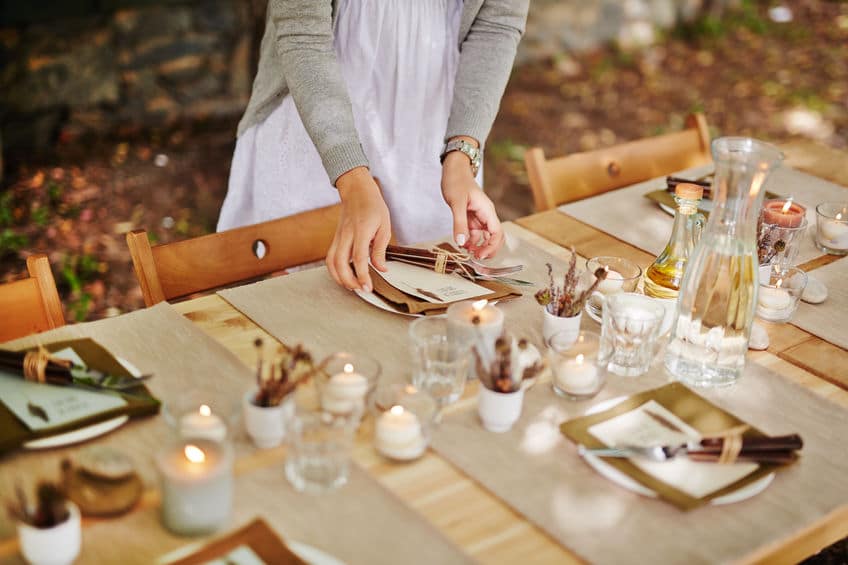 A beautifully decorated dining table helps a Christmas party feel warm and festive. 