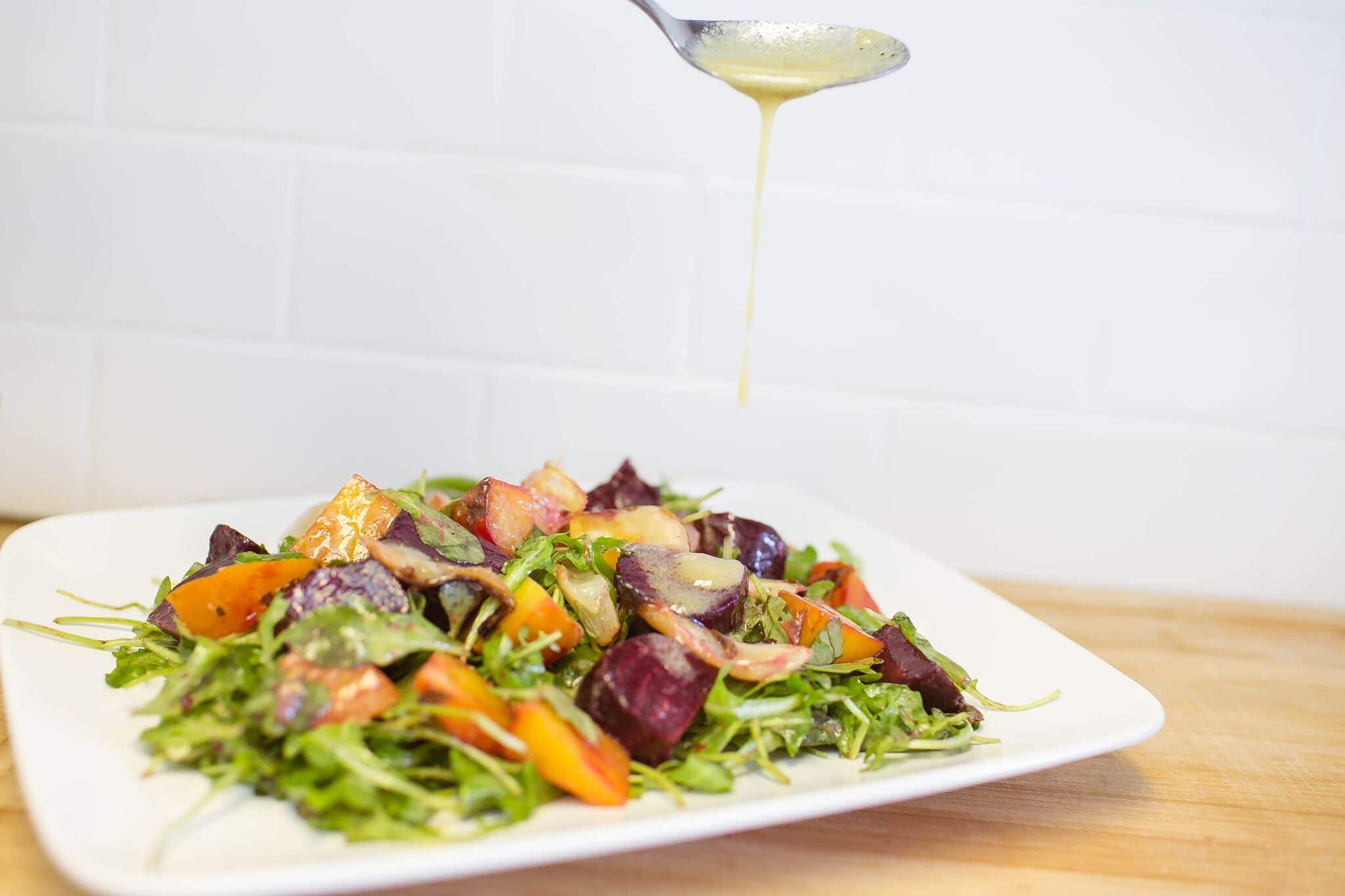 Serve roasted beets and fennel over a bed of arugula and dress with a vinaigrette 