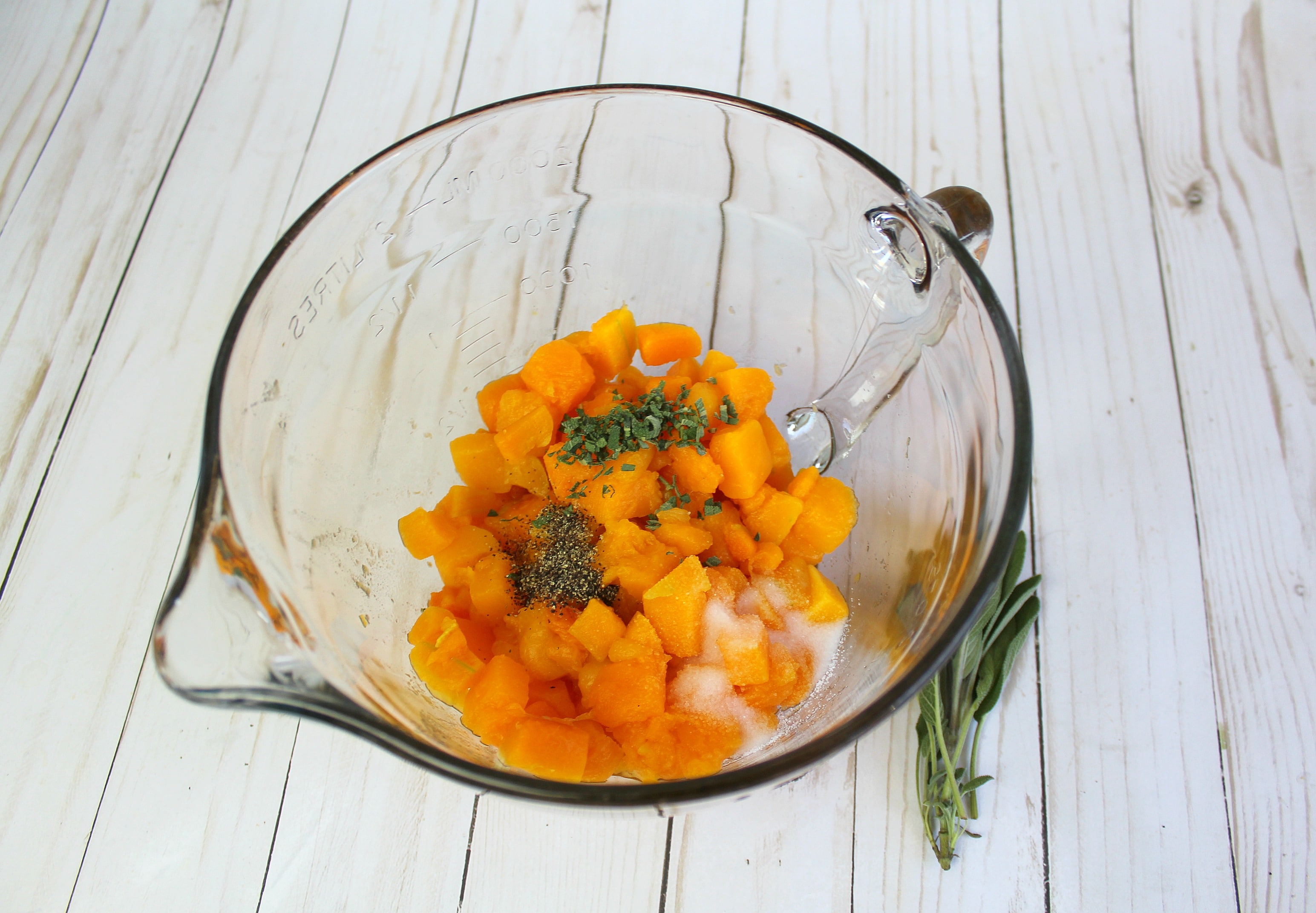 Add squash, salt, and pepper into a bowl and beat with a hand mixer until well-blended. 