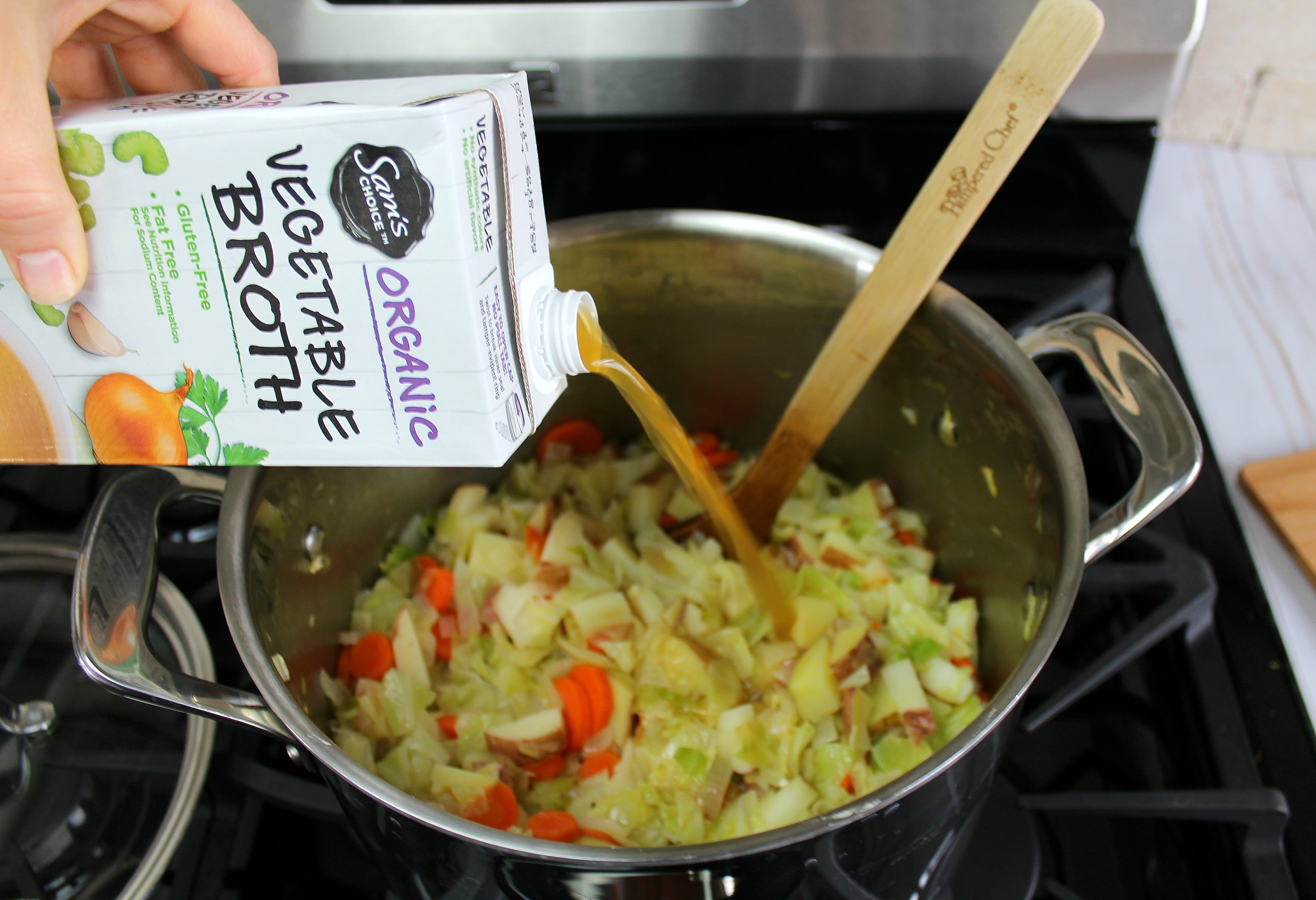 Add the vegetable broth to the soup pot. 