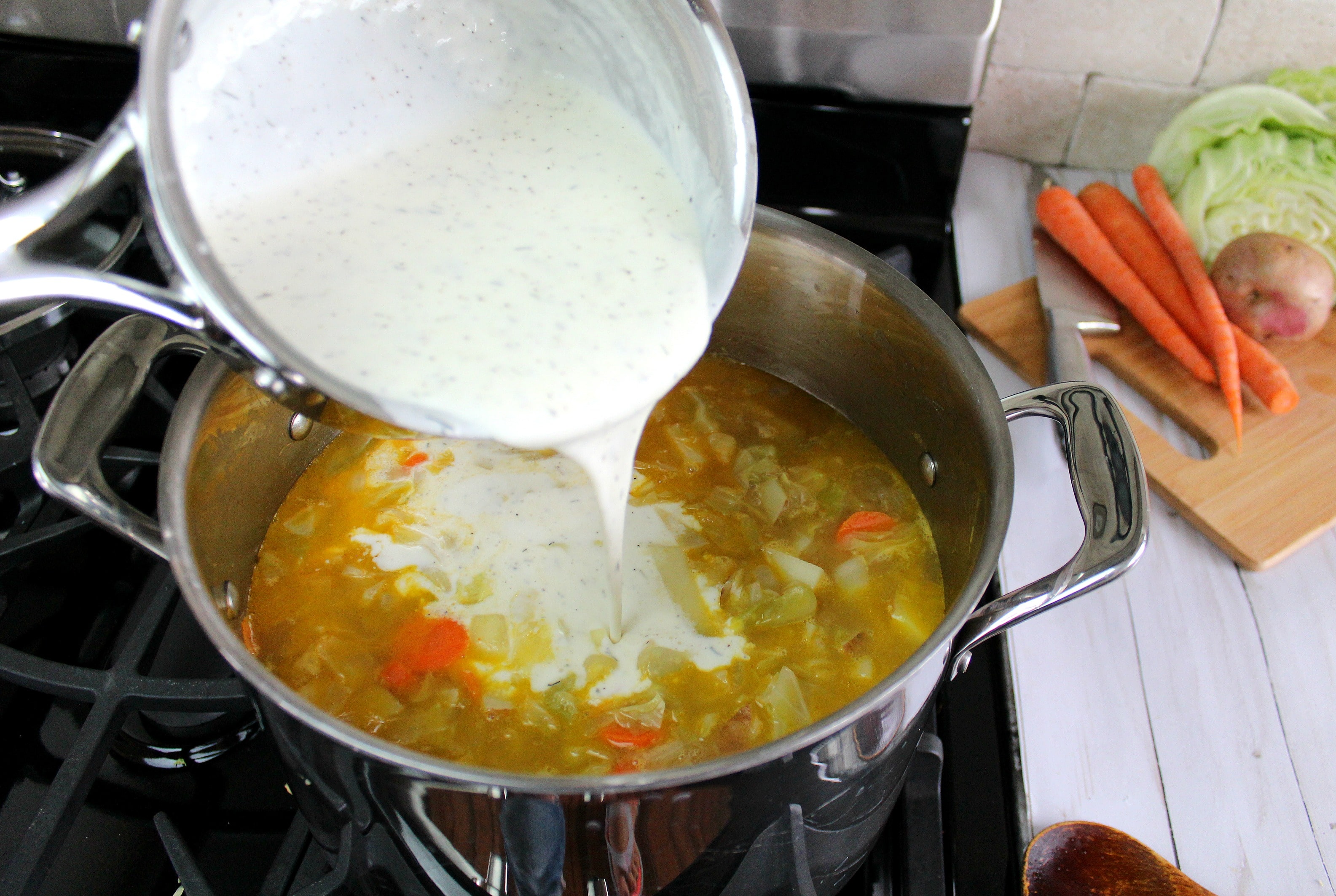 Add cream mixture to the soup pot.