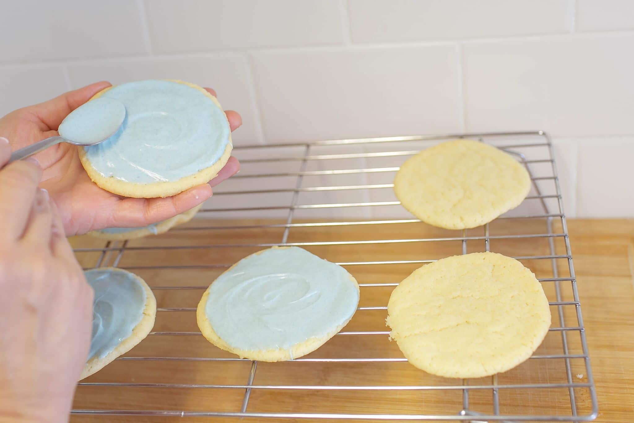 Use melted colored white chocolate mixture to frost sugar cookies. 