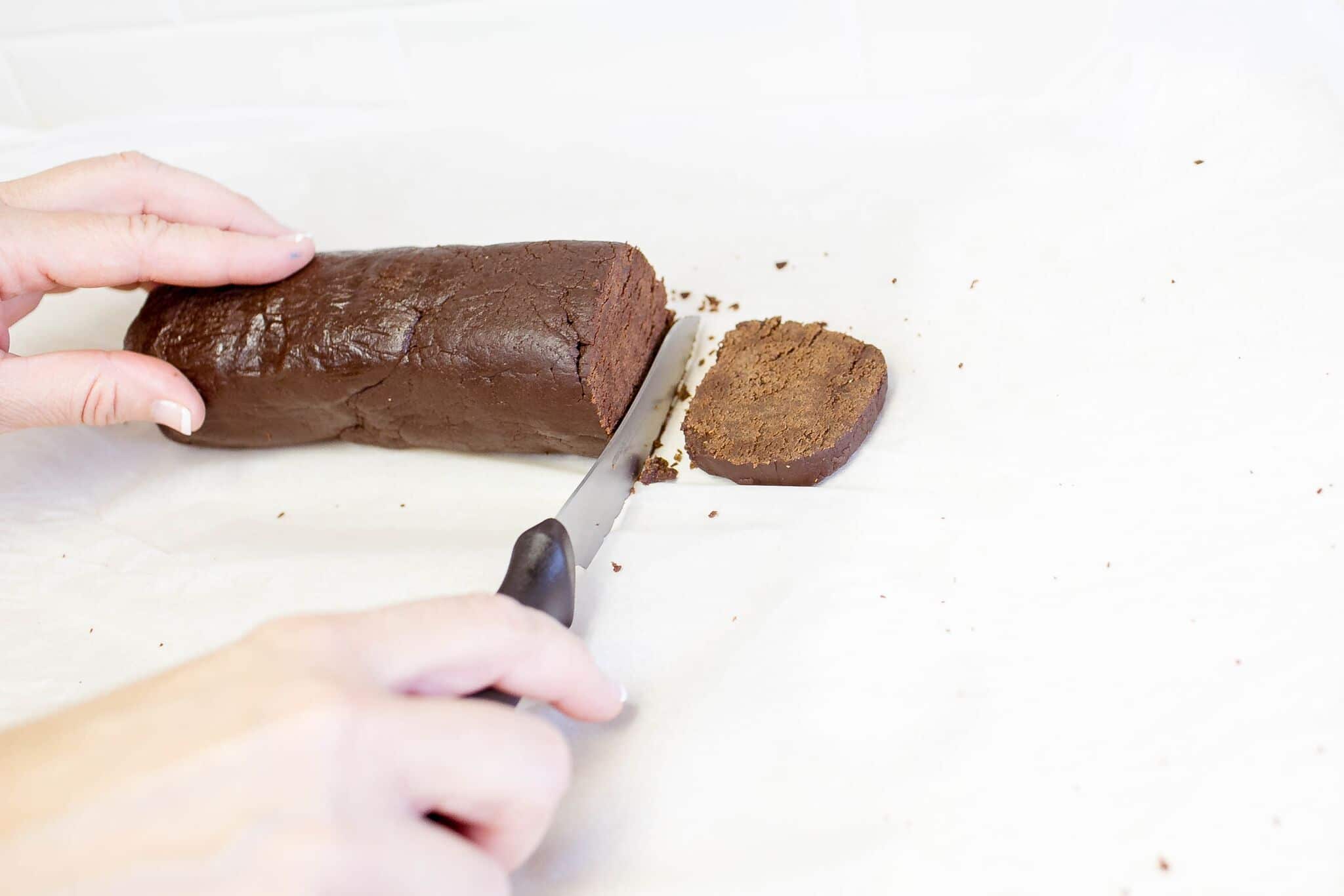 Cut cookie dough into slices. 