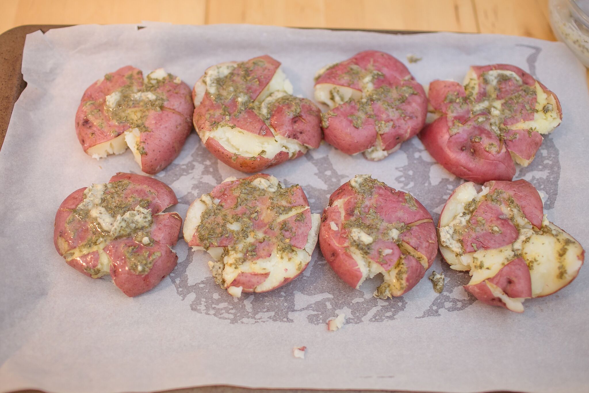 Top each potato with the savory butter.