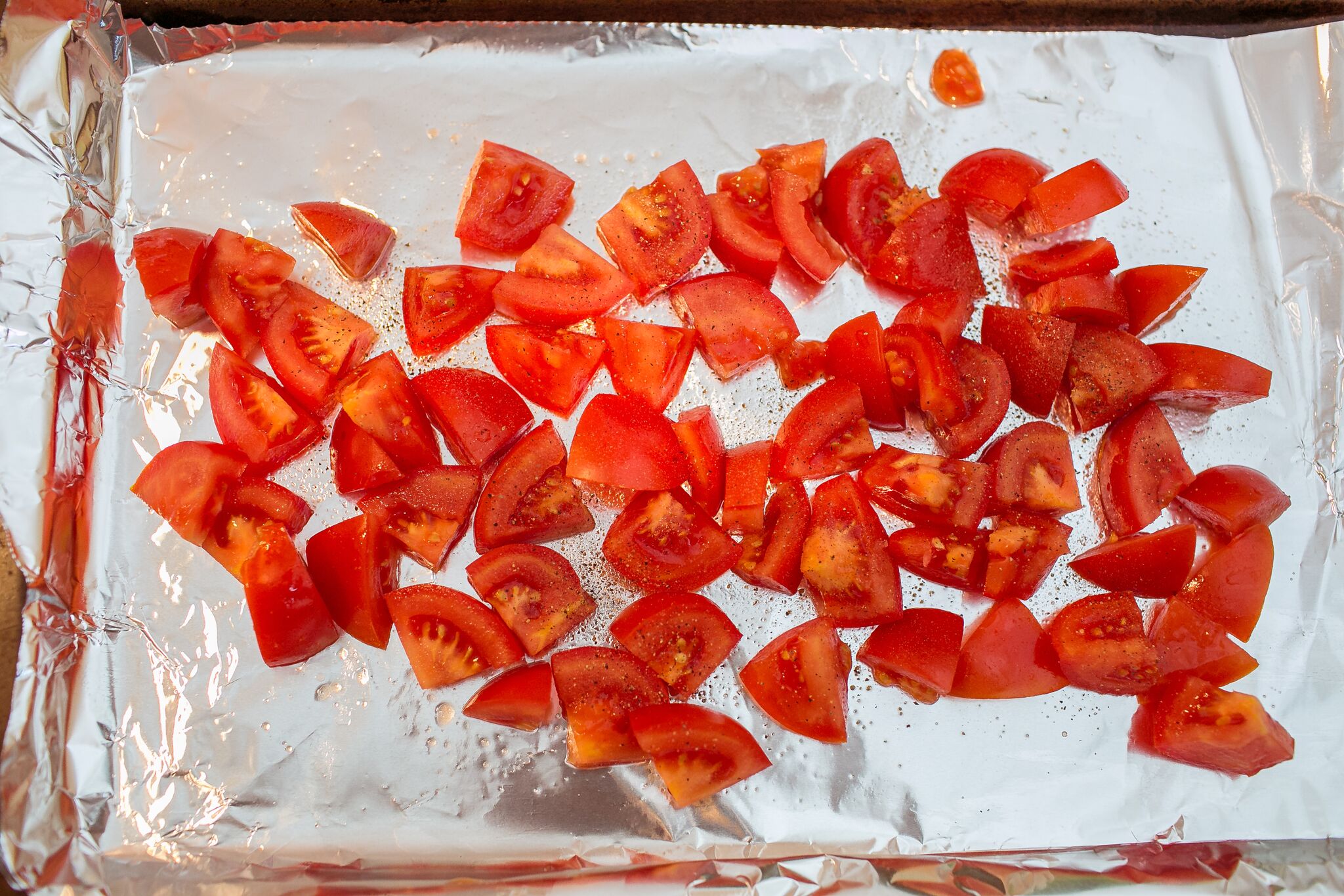 Arrange chopped tomatoes on foil lined pan with with olive oil and salt and pepper.