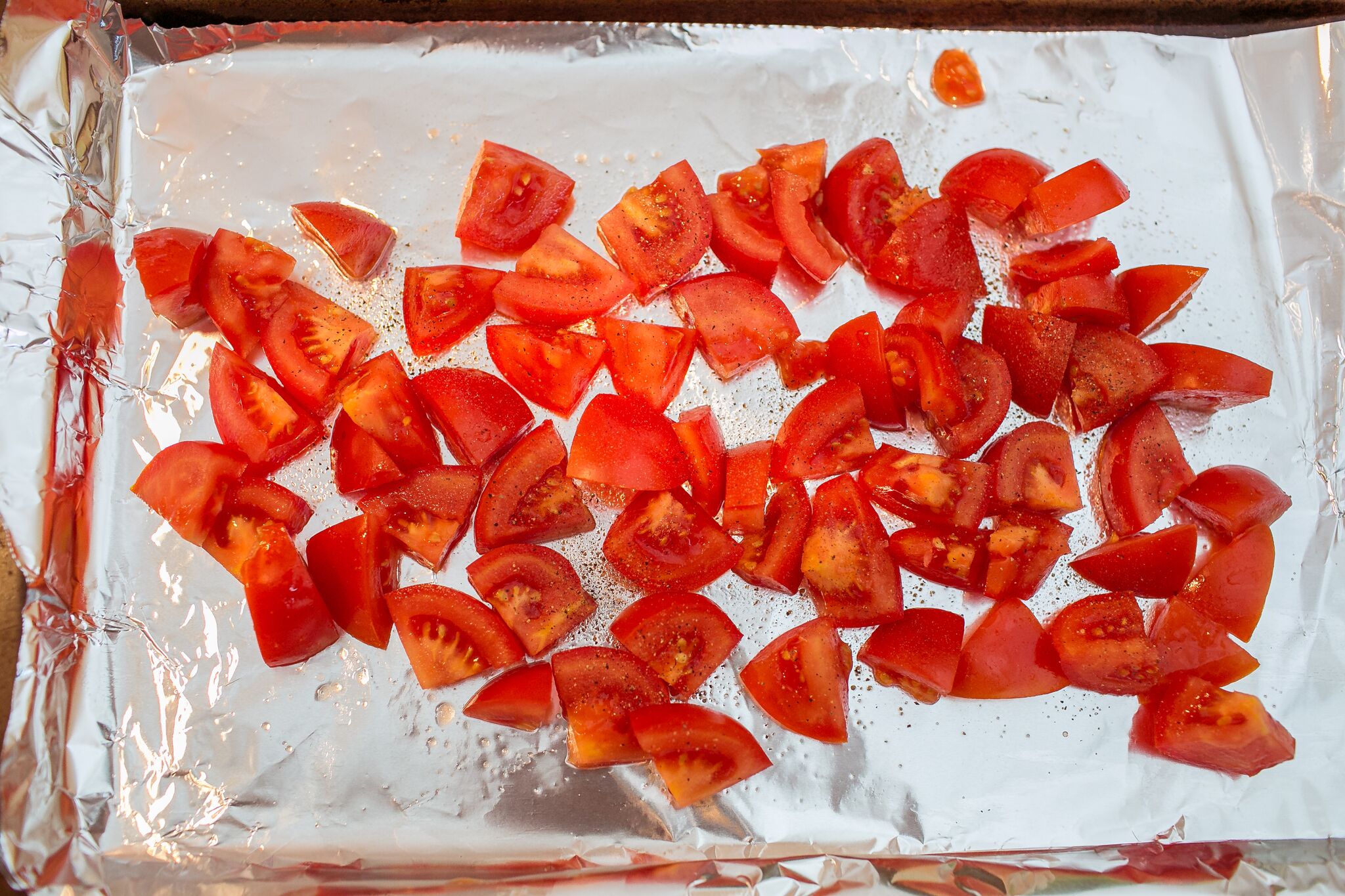 Arrange chopped tomatoes on foil lined pan with with olive oil and salt and pepper. 