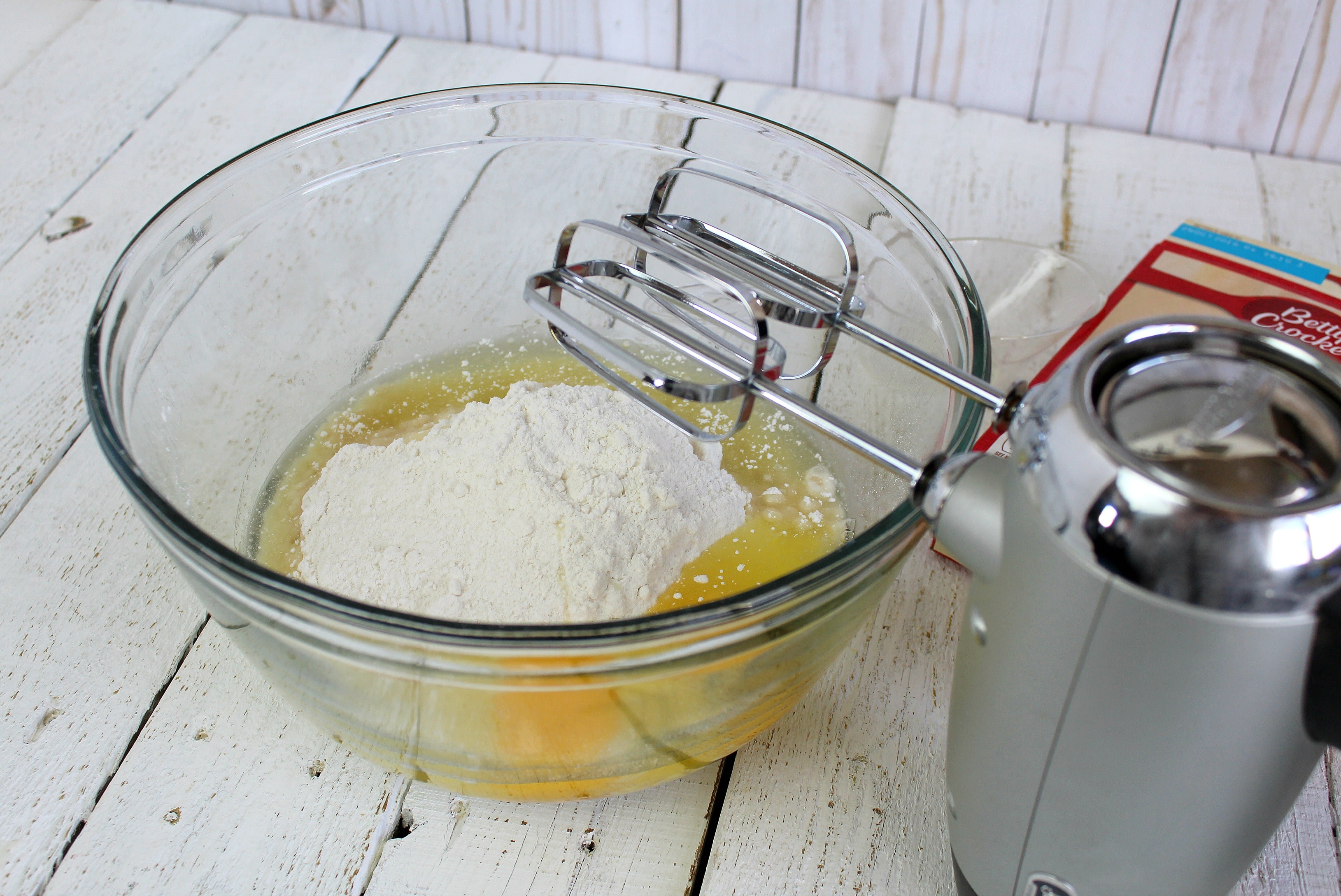 In a large bowl, beat together with electric mixer the white cake mix, oil, and eggs until well combined.