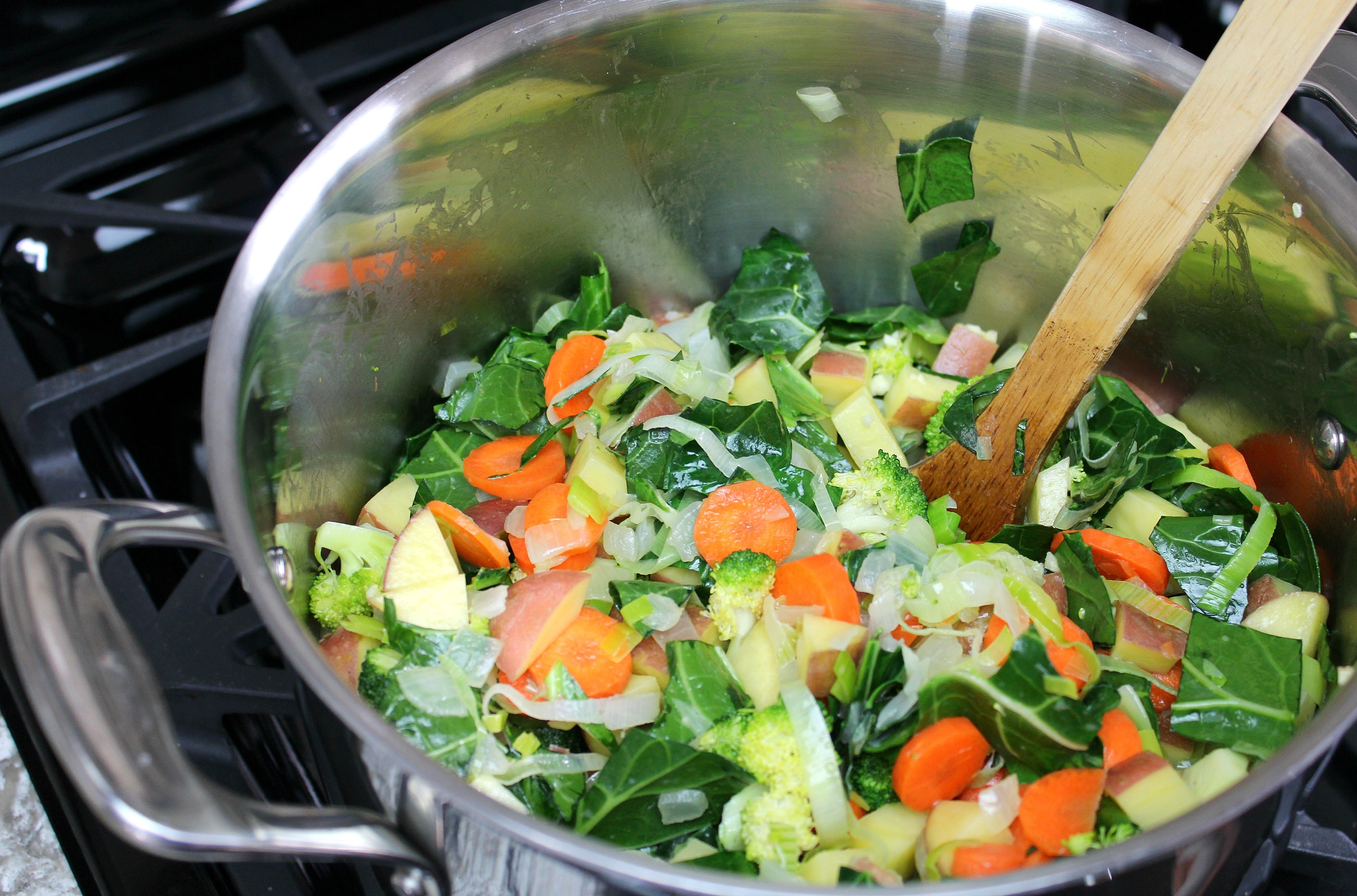 Combine chopped vegetables and butter into large pot. 