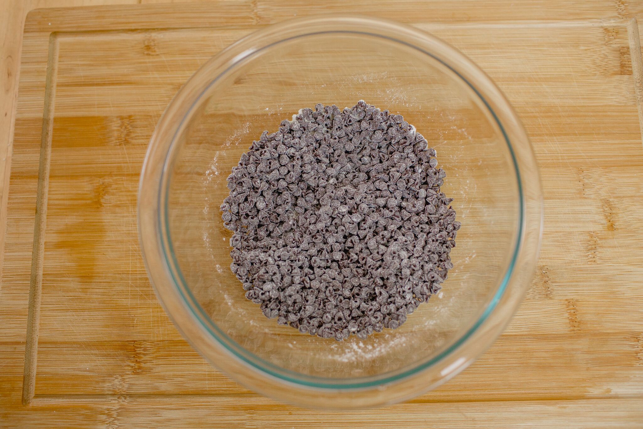 Add 1 tablespoon of flour to your mini chocolate chips in a bowl. 