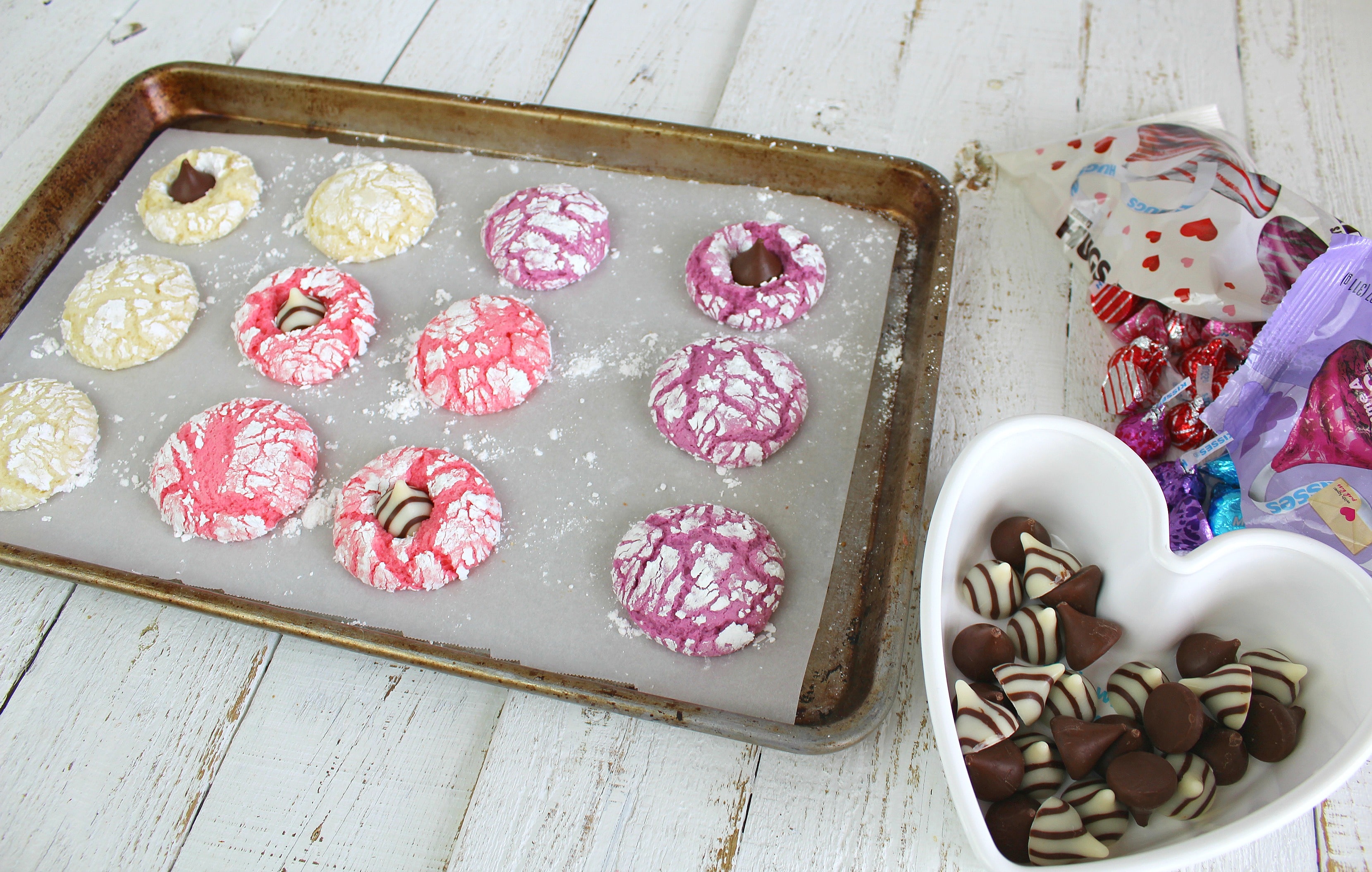 Place Hershey kisses in the center of cookies. 