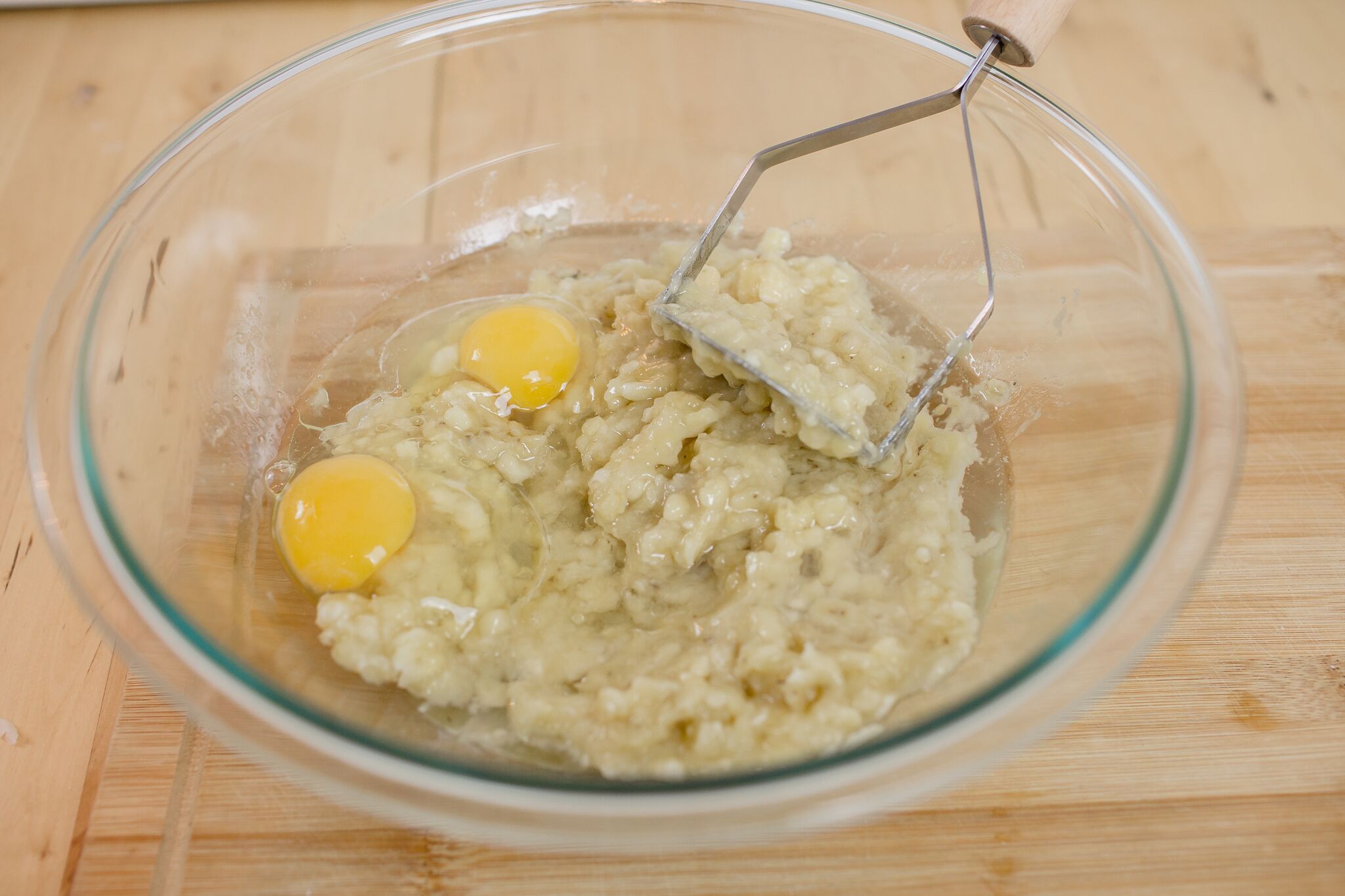 In a large bowl mix together the mashed bananas, coconut oil and eggs.