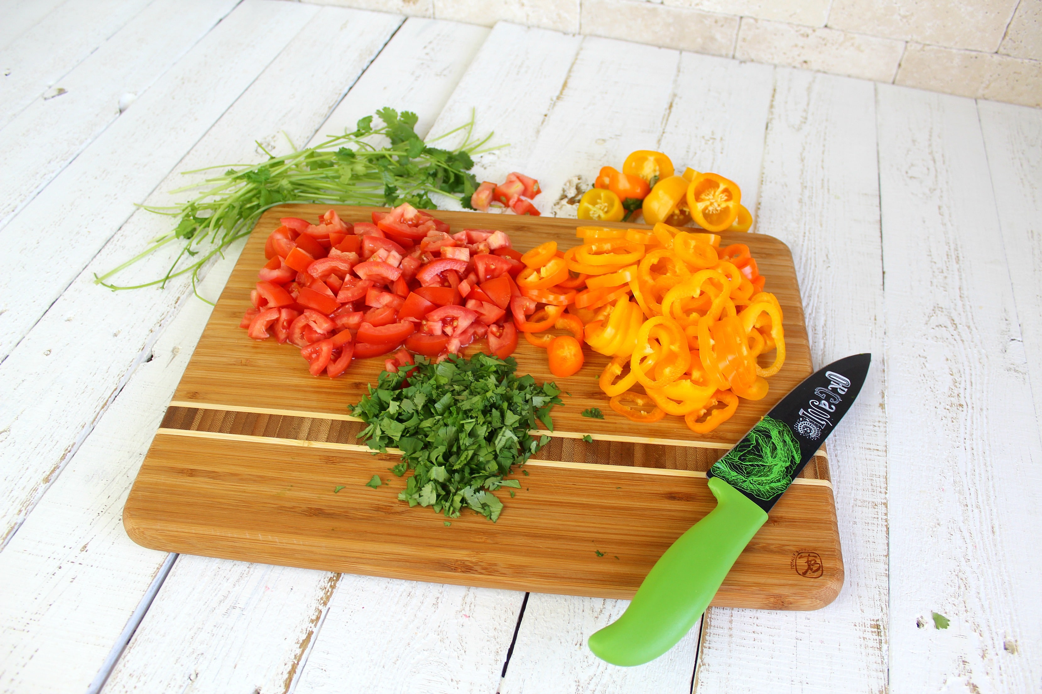 Cut peppers into rings, chop tomatoes into bite-sized pieces, and chop cilantro finely.