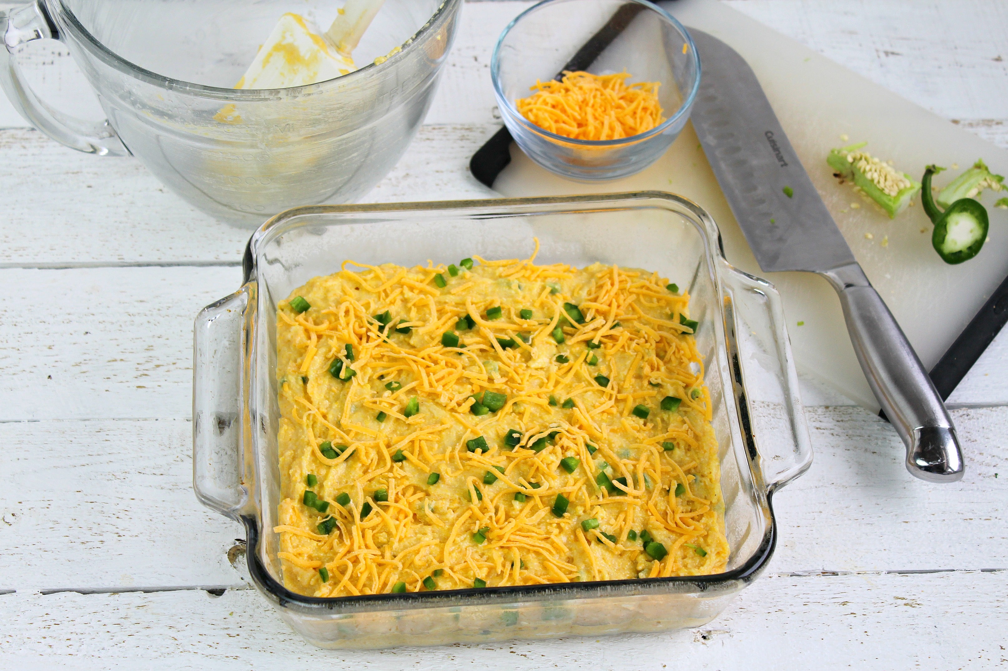 Pour into baking pan and top with jalapenos and shredded cheese
