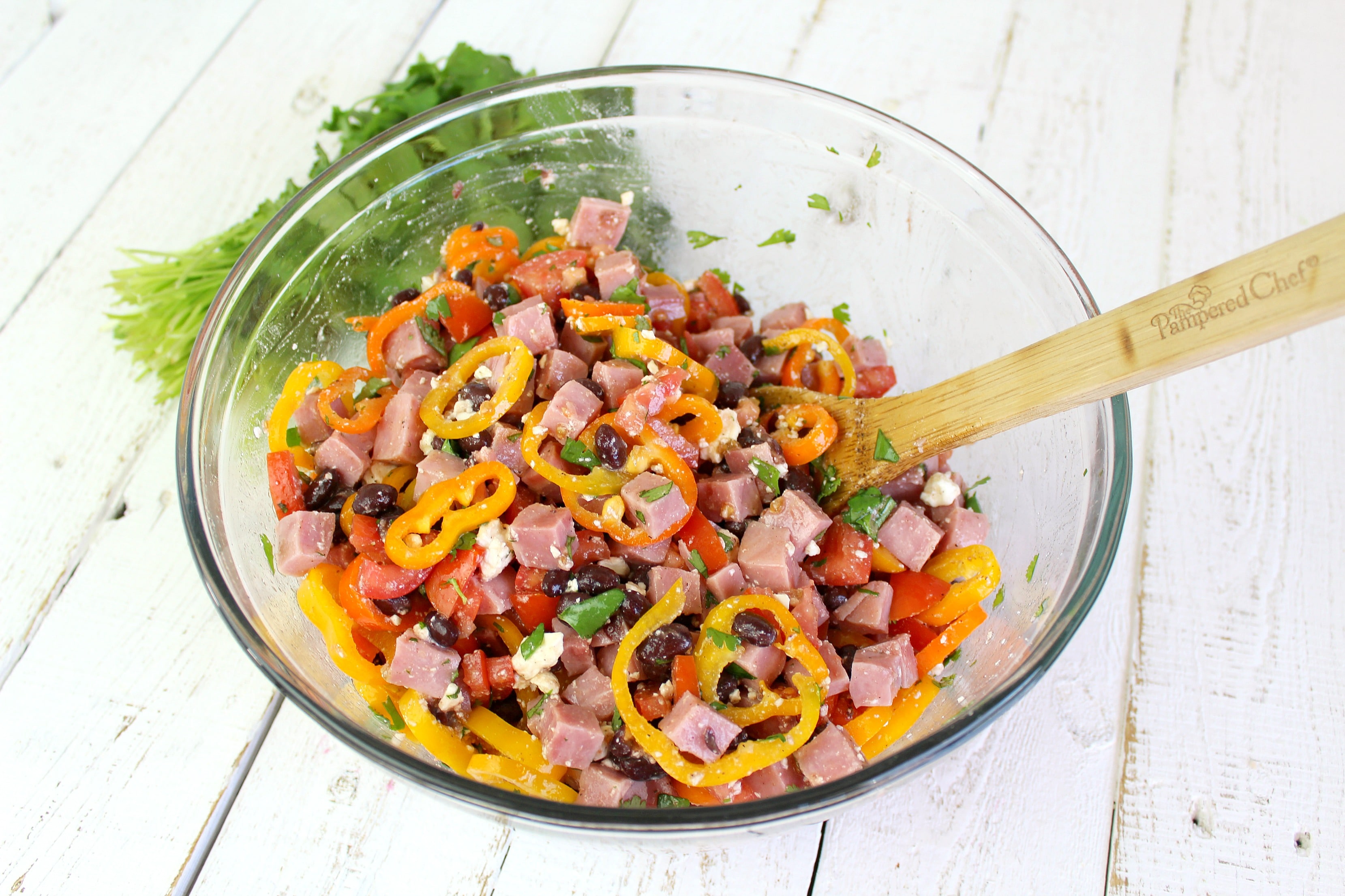 Using a large spoon, mix all ingredients together in bowl.