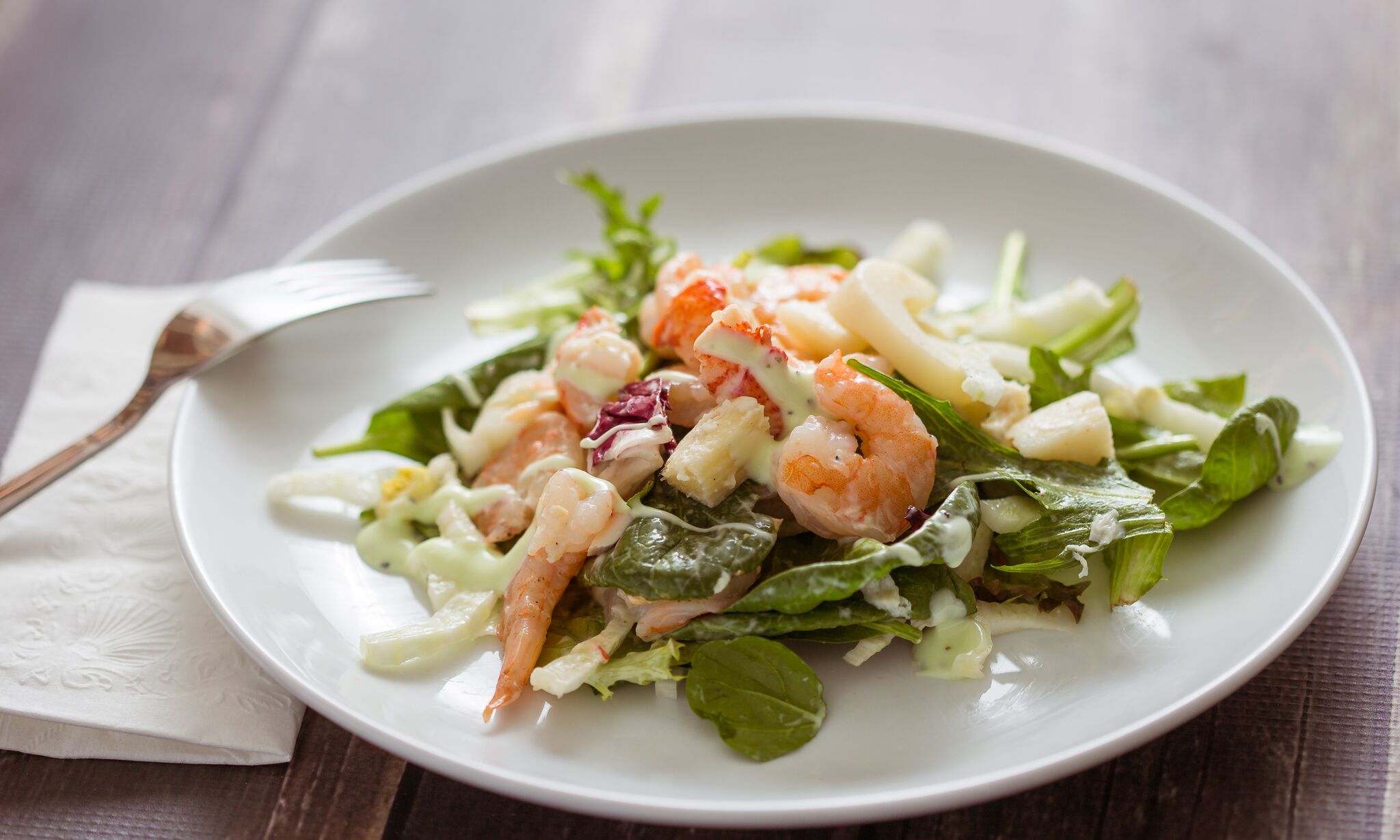 Serve salad on a plate and enjoy. 