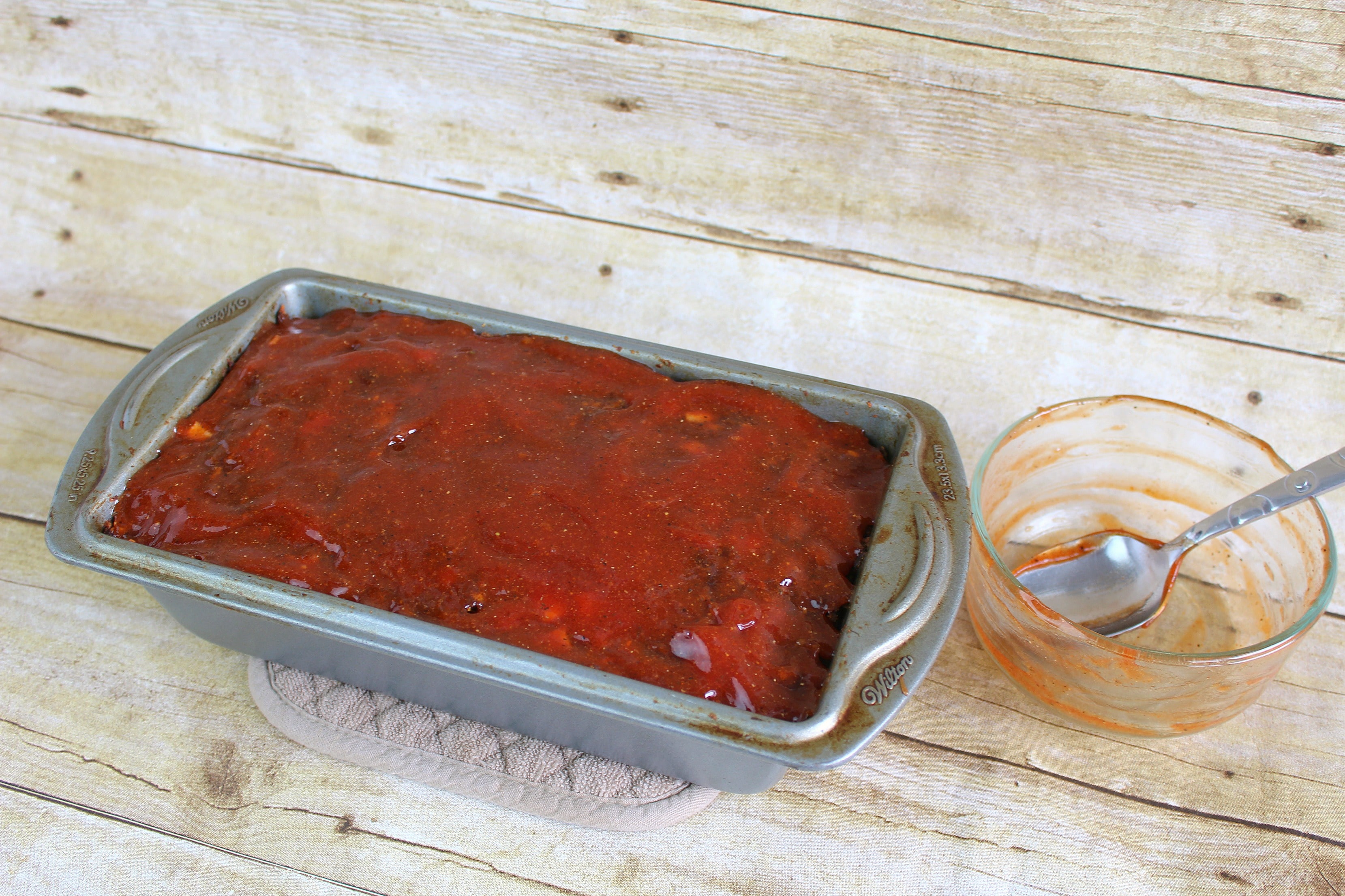 Apply sauce to the top of the meatloaf after it's cooked for about and hour