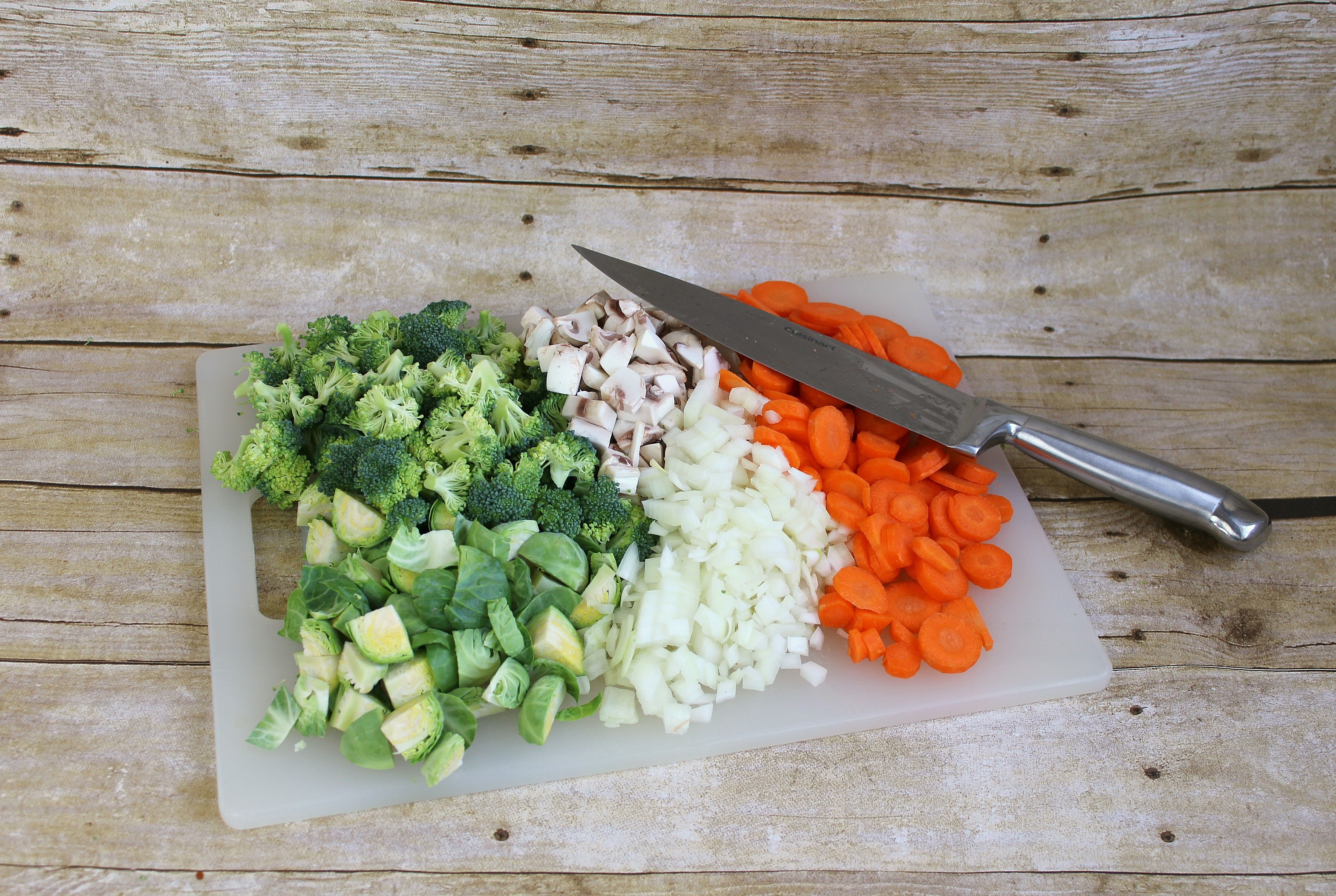 Chop broccoli, onions, carrots, and mushrooms and set aside