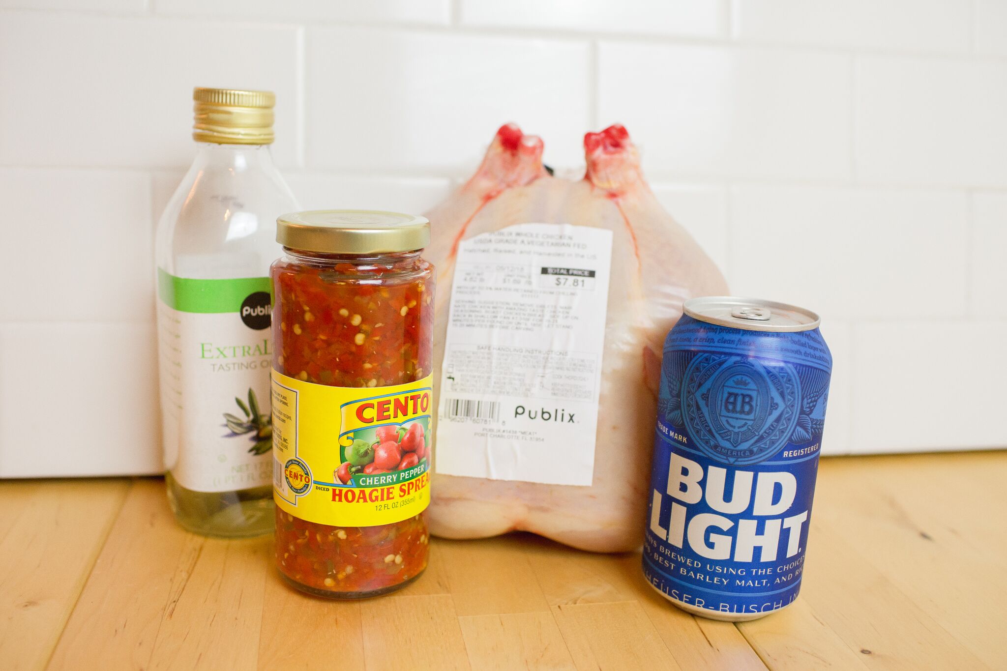 This simple beer can chicken recipe only calls for 4 ingredients - chicken, Centro Hoagie Spices, olive oil, and a can of beer