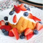 This red white and blue- strawberry, blueberry shortcake is the perfect festive 4th of July summer dessert. Perfect for your next Independence Day party! #summerdesserts #4thofjuly #strawberryshortcake